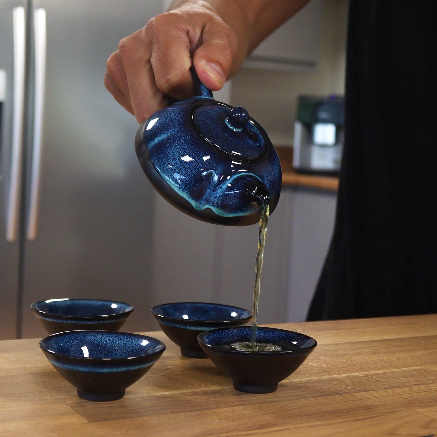 200ml Blue Glazed Ceramic Teapot Pouring Tea into a Matching Cup