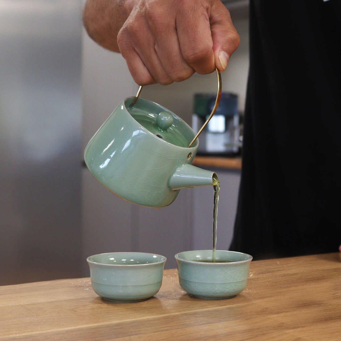 200ml Jade Ceramic Herbal Teapot Pouring Tea into a Matching Cup