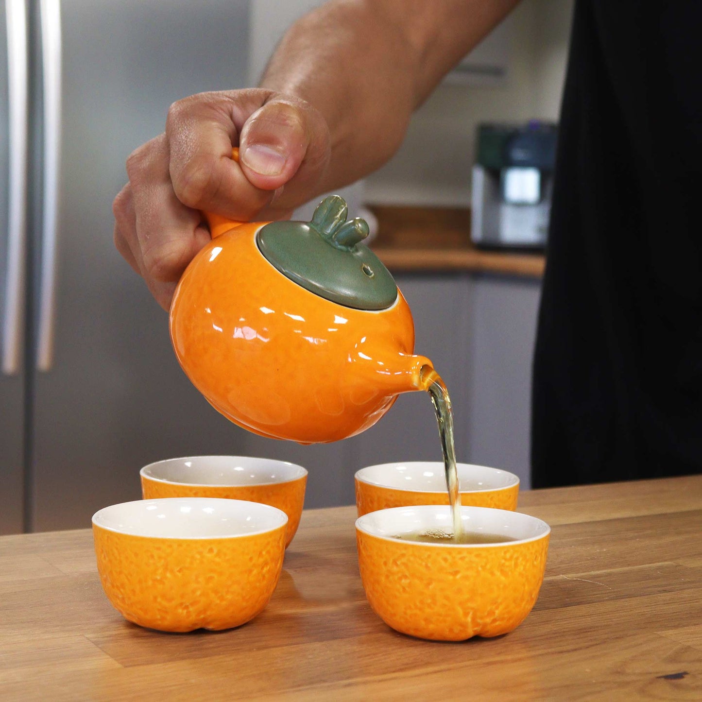 200ml Orange Glazed Ceramic Teapot Pouring Tea into a Matching Cup