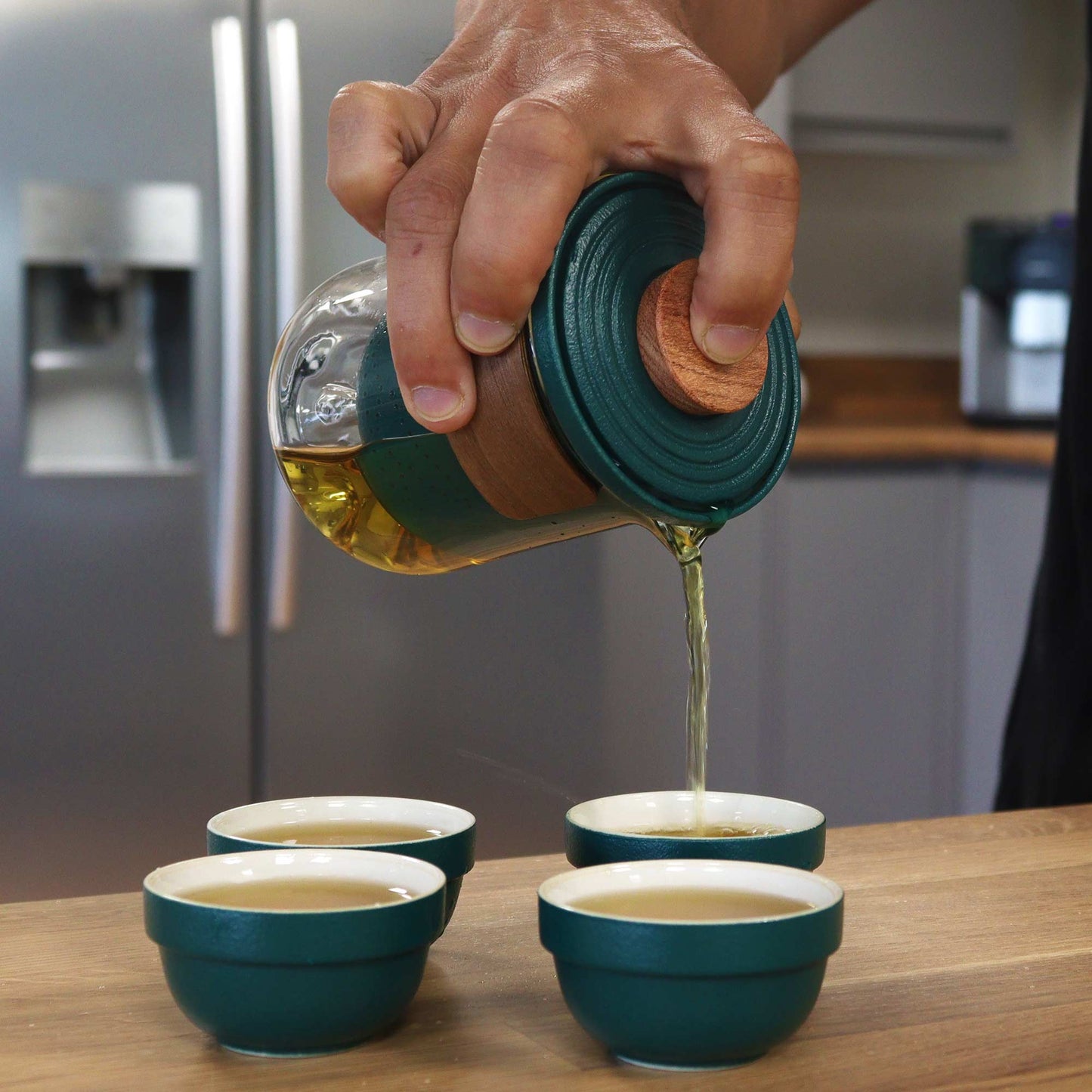 300ml Mountain Travel Teapot Pouring Tea into one of then4 Cup Set