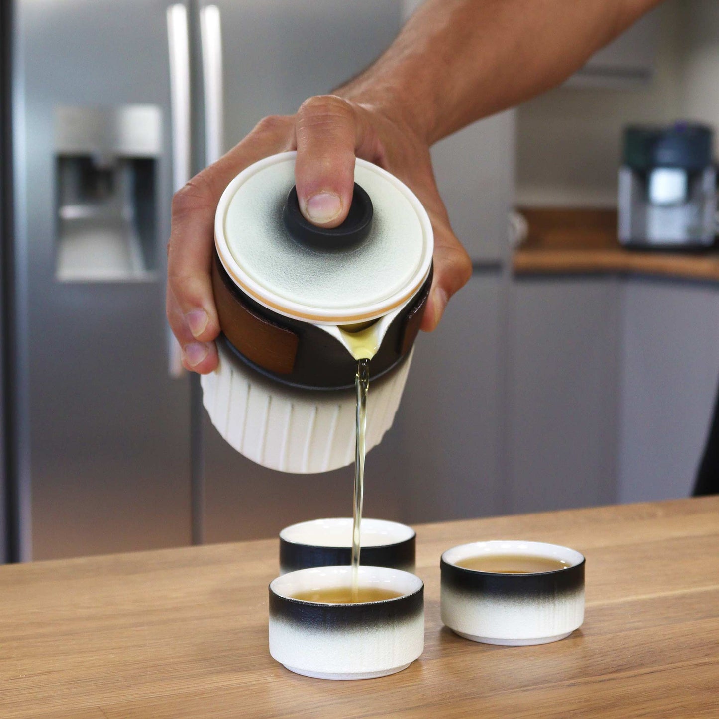 350ml Ceramic Teapot Pouring Tea into one of the Matching Cups from the Set