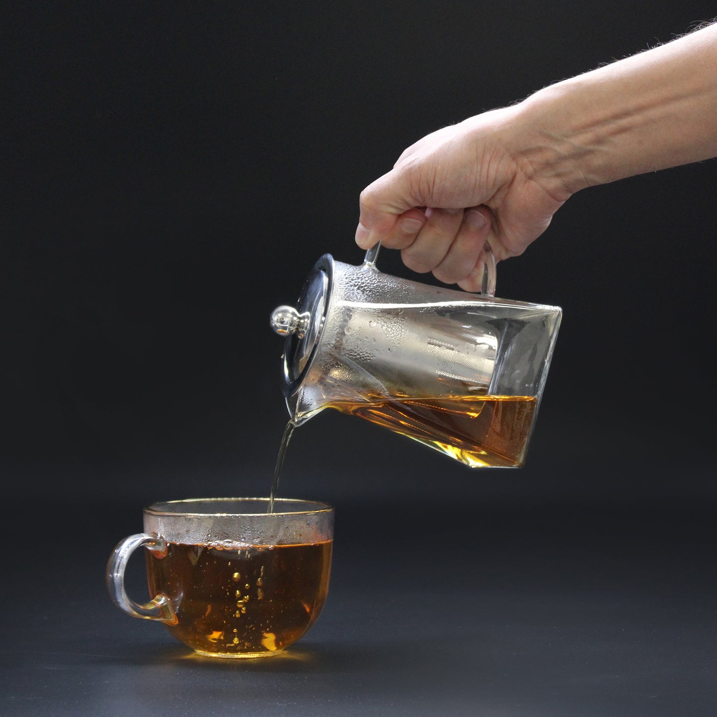350ml Glass Tower Infuser Teapot Pouring Tea into a Tea Cup