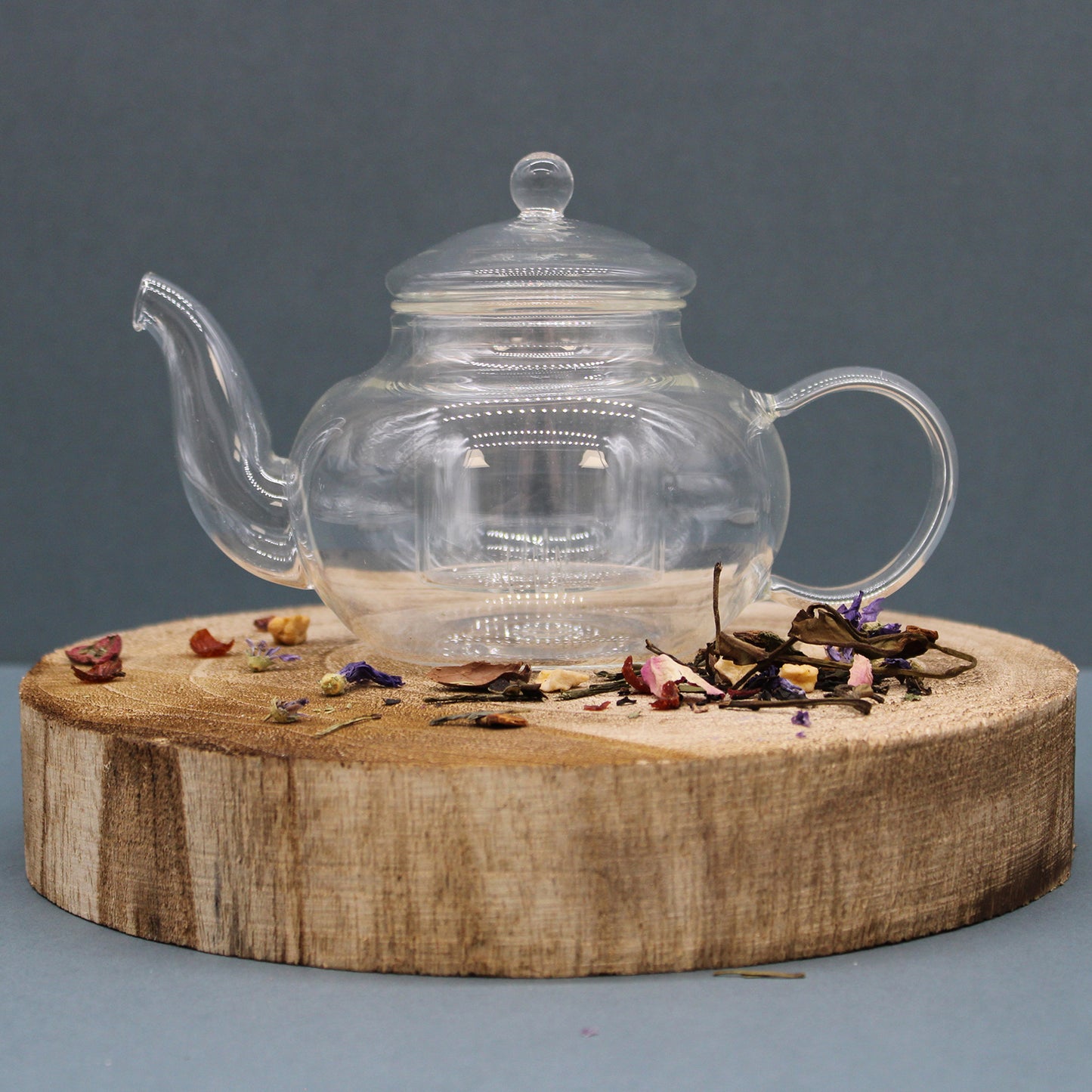 400ml Glass Round Pearl Infuser Teapot Sitting on a Chopping Board
