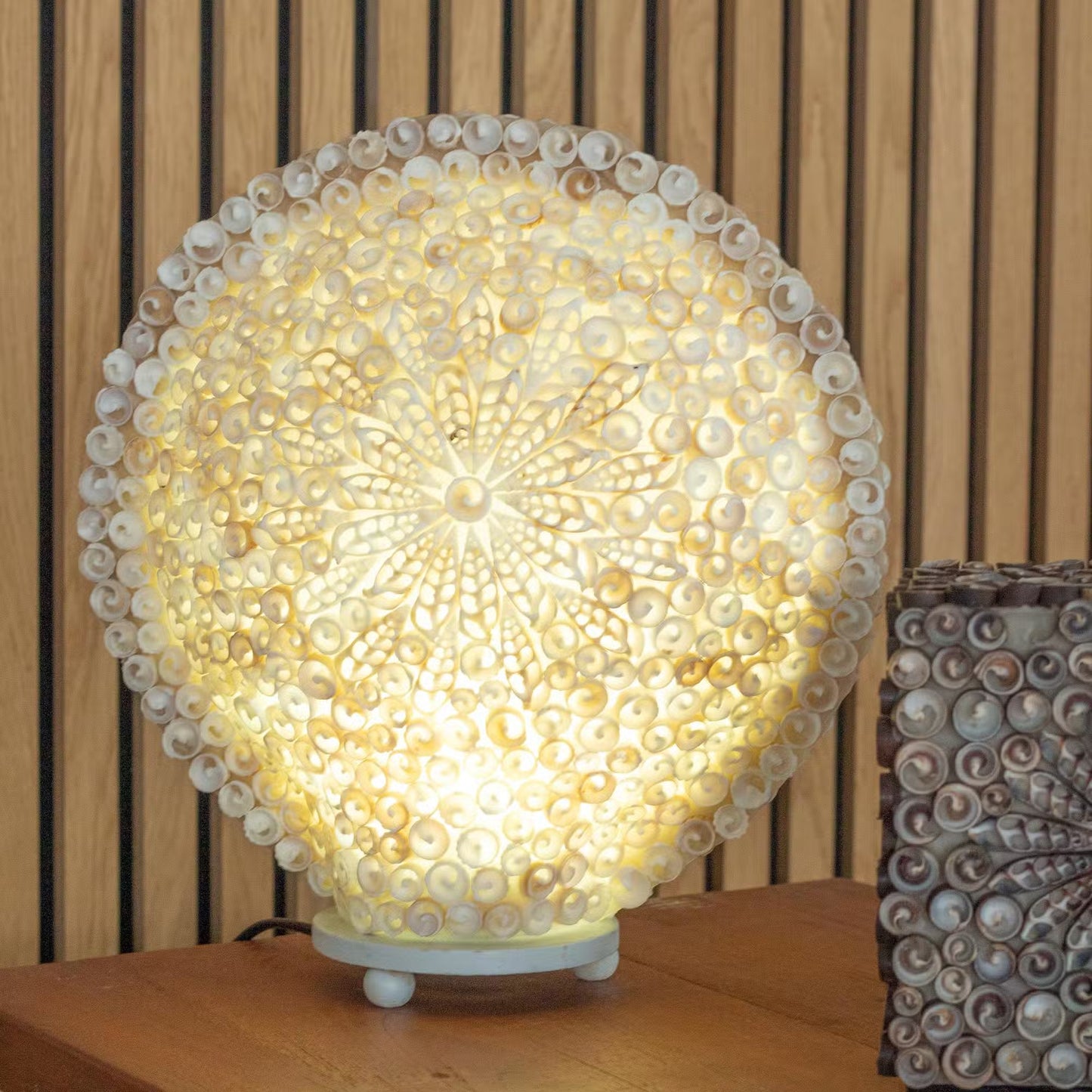 Handcrafted LED Boho Seashell Lamp - Extra Large Decorative Round glowing warm yellow with a radial shell pattern by Quintessential Holistic Health Ltd