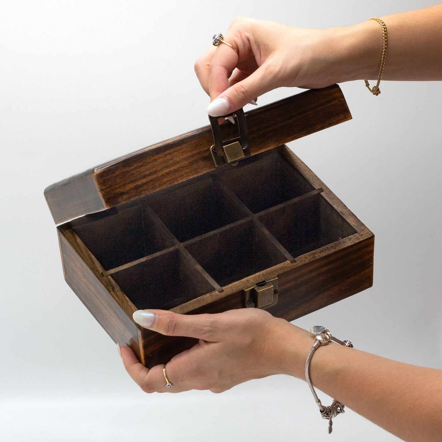Woman Holding a Mango Wood Vintage Style Carved Tea Box with 6 Compartments