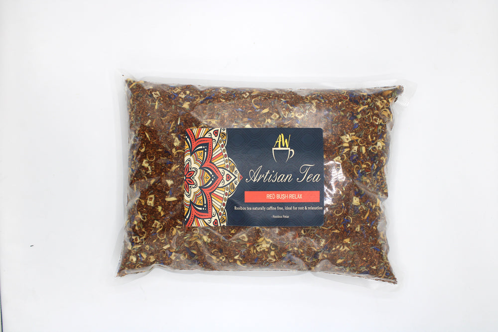 In a clear rectangular bag with a dark Artisan Tea label; Rooibos Red Bush Relax rooibos tea from Quintessential Holistic Health.