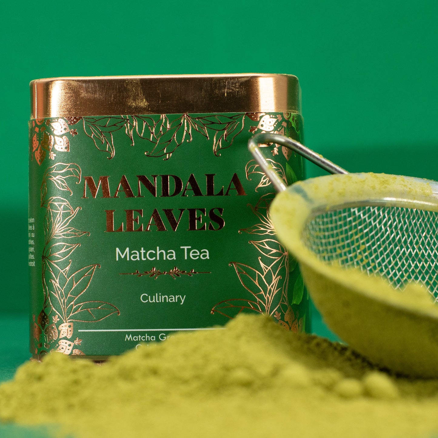 Organic Culinary Matcha Green Tea - Tinned - 50g, tin framed by green powder and a metal sieve, by Quintessential Holistic Health Ltd