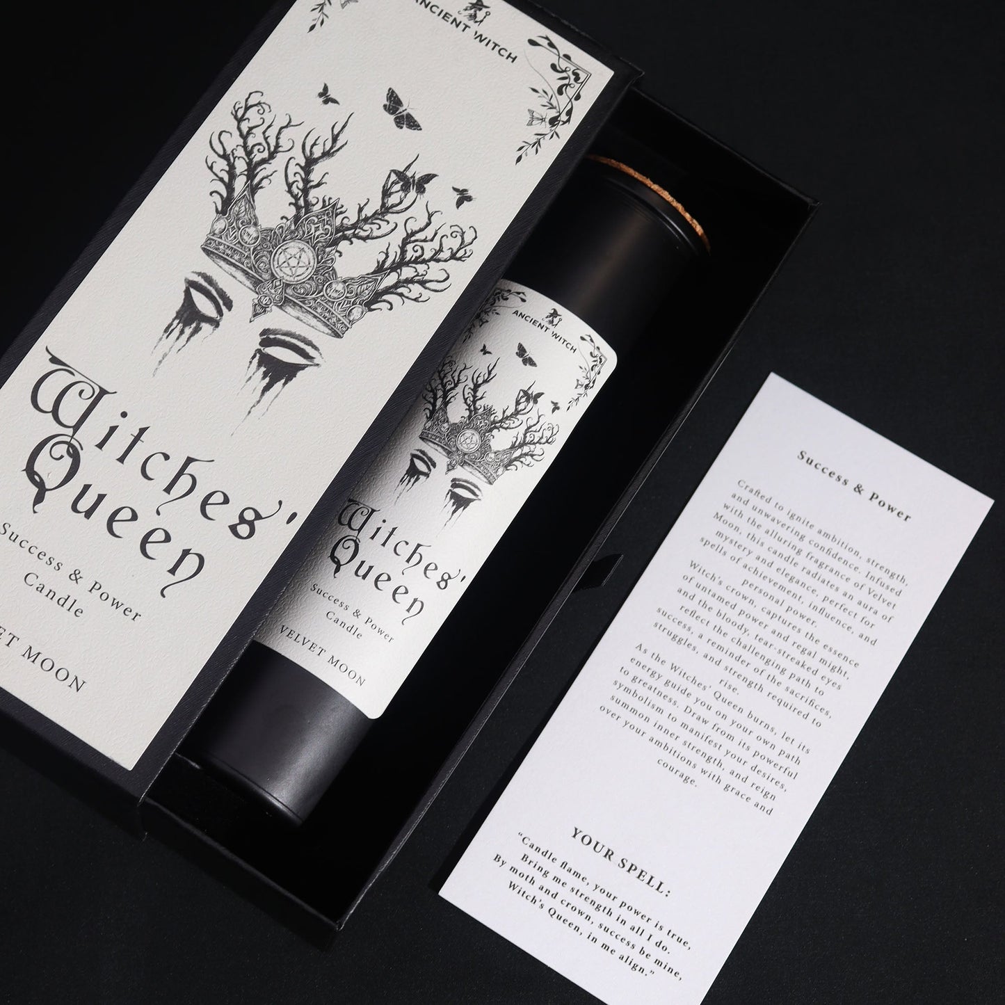 Ancient Witch Ritual Candles - Witches' Queen - Power and Success in an open black box beside a printed card on black by Quintessential Holistic Health Ltd