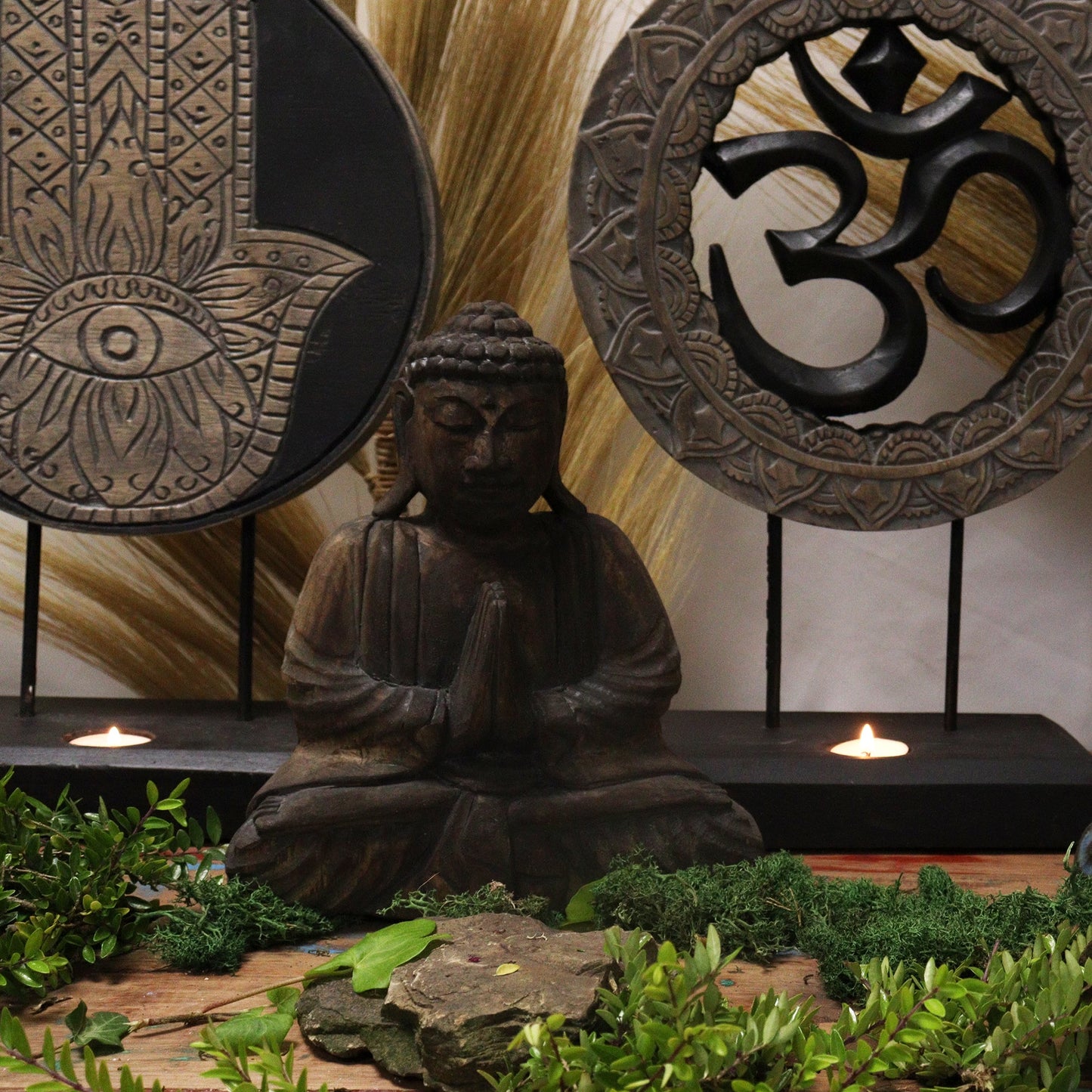Albasia Wood Buddha Feng Shui Set - Om - Grey and Black, displayed with a seated Buddha and two circular framed symbols, by Quintessential Holistic Health Ltd