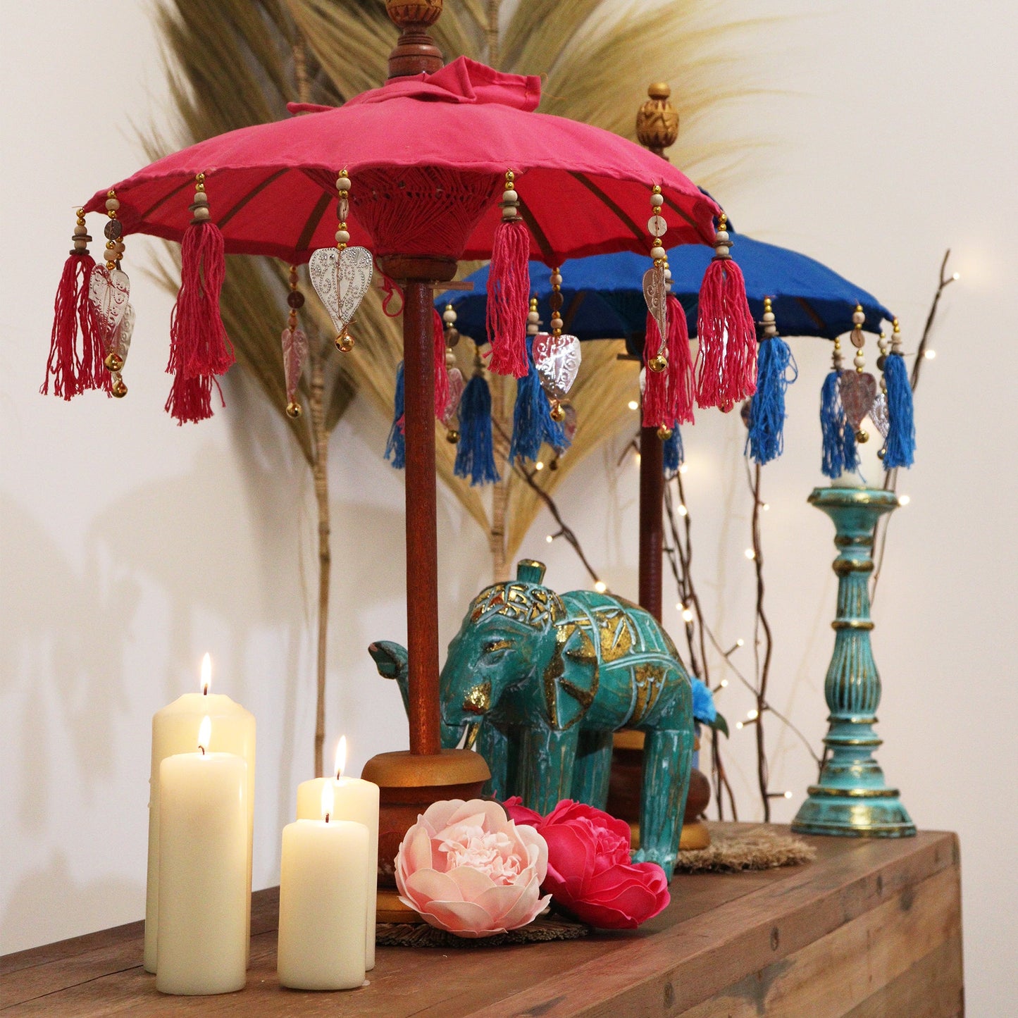 Handcrafted Indoor Parasol with Stand - Small - Plain - Pink, open above a decorative elephant, candles and flowers, by Quintessential Holistic Health Ltd