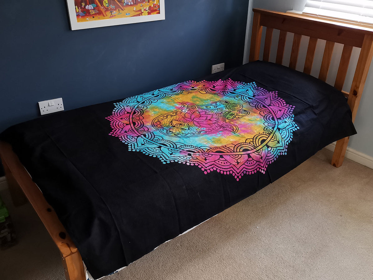 Cotton Wall Hanging or Bedspread - Single - Black Hamsa, spread across a single bed with its colourful circular Hamsa design visible by Quintessential Holistic Health Ltd