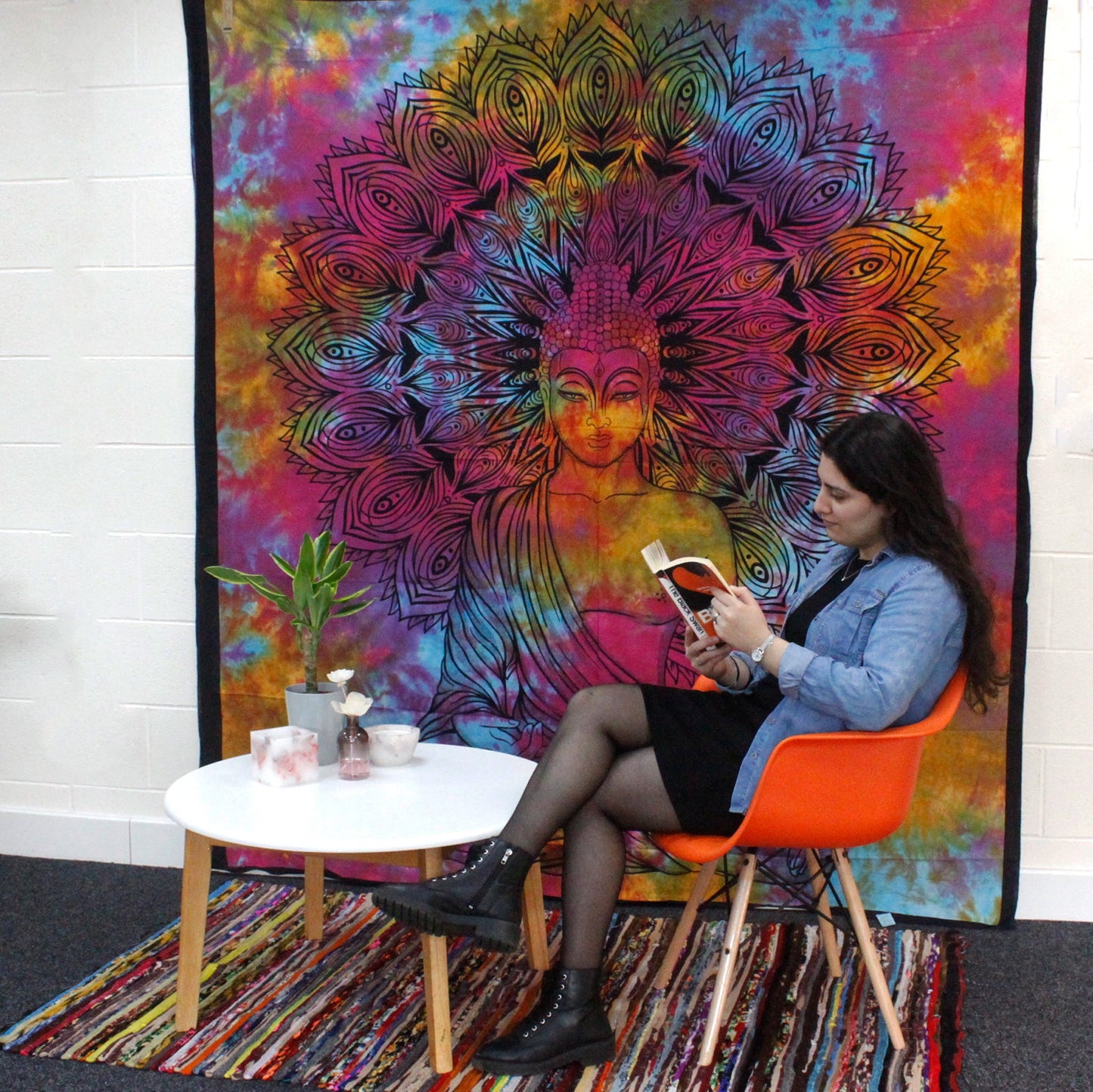 Cotton Wall Hanging or Bedspread - Double - Circle of Ages displayed behind a seated reader at a white table by Quintessential Holistic Health Ltd