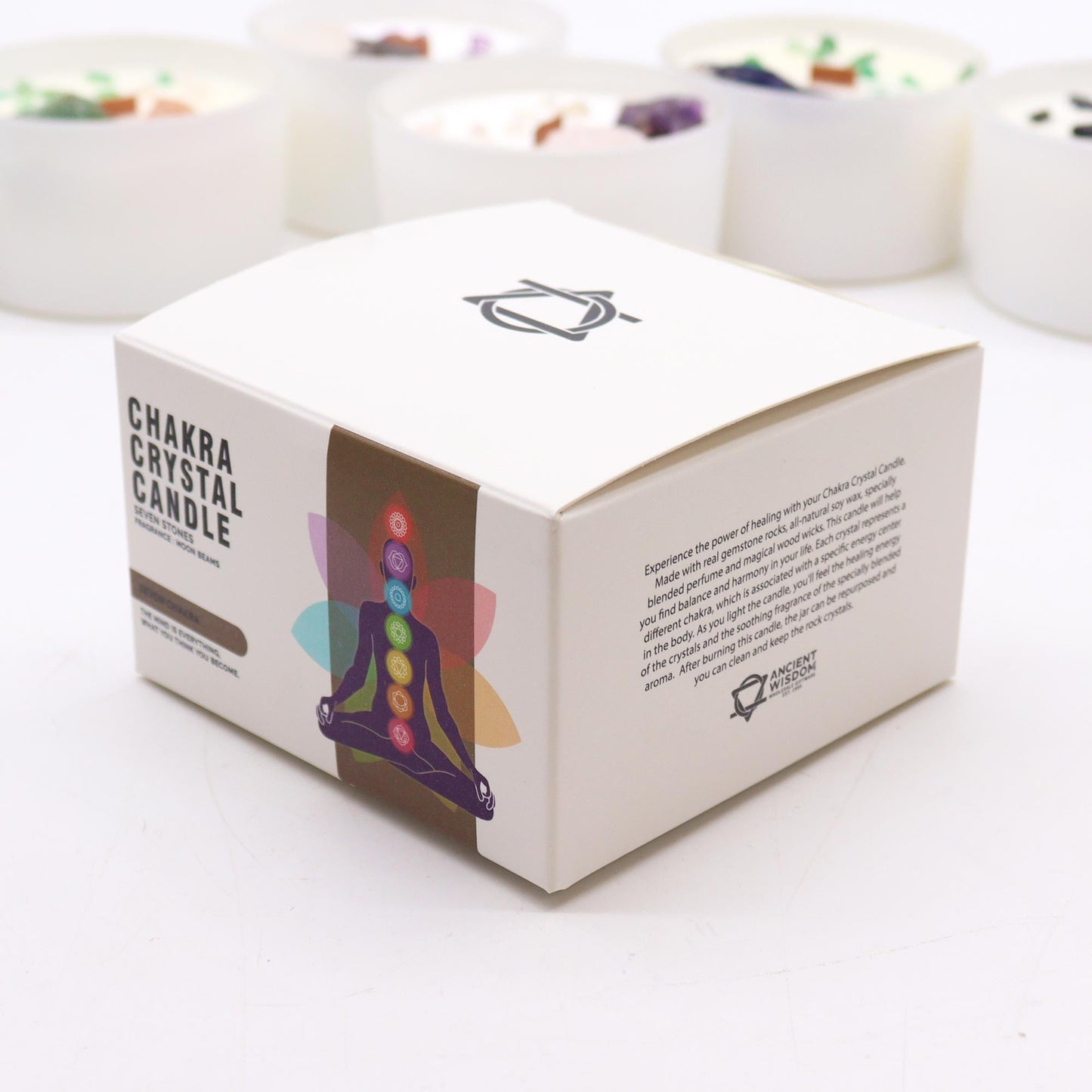 Large Seven Chakra Scented Soy Wax Crystal Candle shown in a white box with a seated chakra figure design by Quintessential Holistic Health Ltd