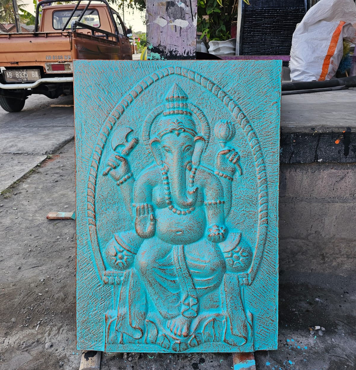 Handmade Concrete and Resin Ganesh Wall Plaque - Turquoise and Gold product packaging on clean background from Quintessential Holistic Health Ltd