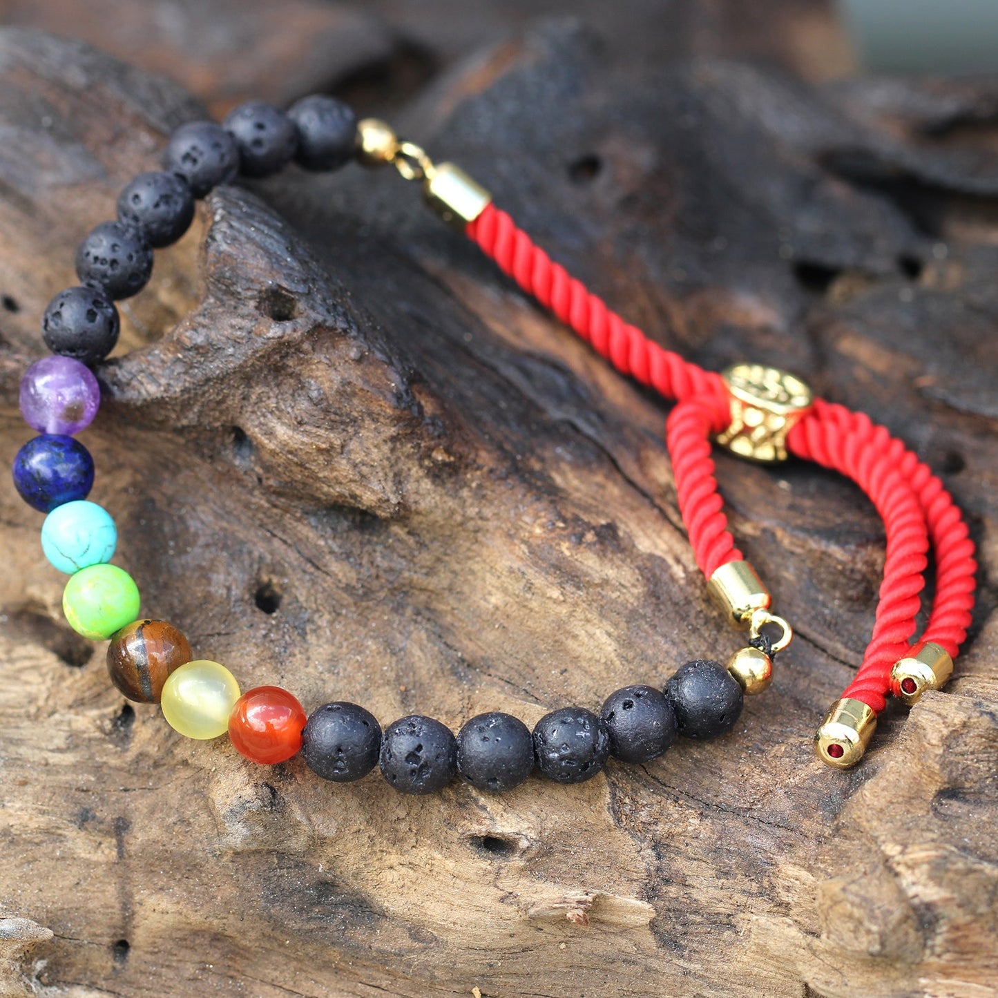 Unisex Handcrafted 18K Gold Plated Gemstone Bracelet - Red String / Lava Stone Chakra product packaging on clean background from Quintessential Holistic Health Ltd