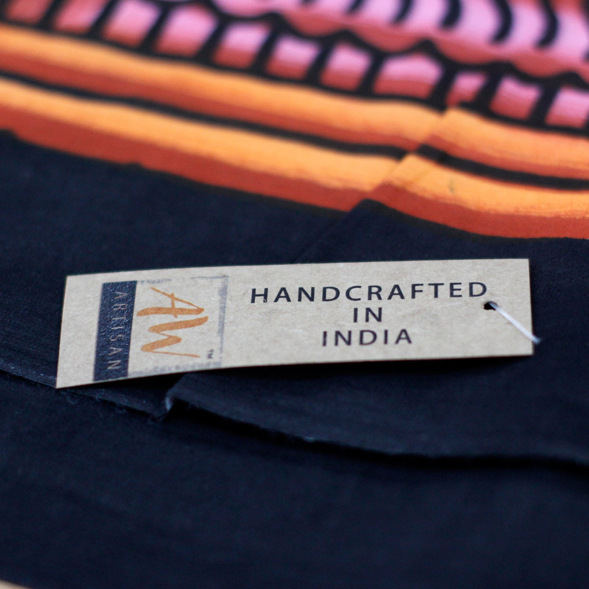 Hand-Brushed Cotton Wall Art - Kamasutra, close view of a Handcrafted in India label against dark fabric, by Quintessential Holistic Health Ltd