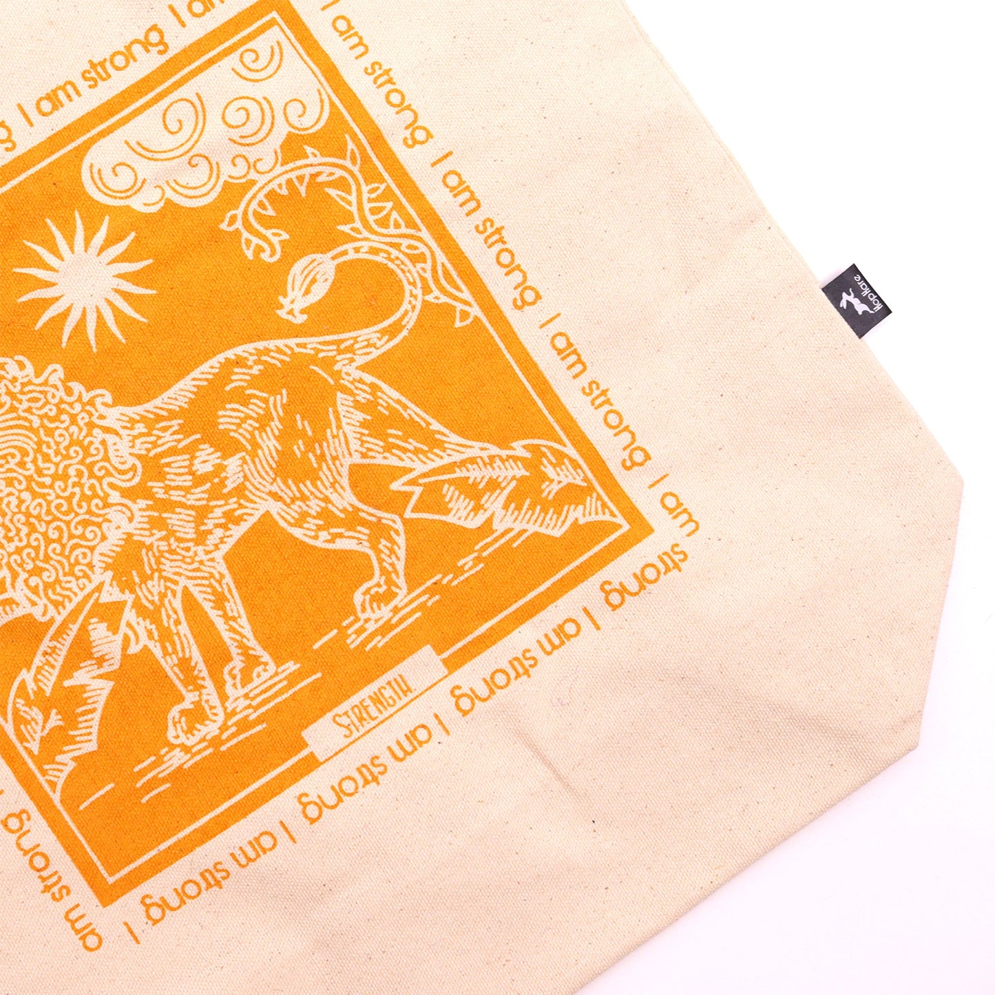 Lion Tarot Card Cotton Canvas Tote Bag - I Am Strong with a close-up orange illustration of a lion and sun by Quintessential Holistic Health Ltd
