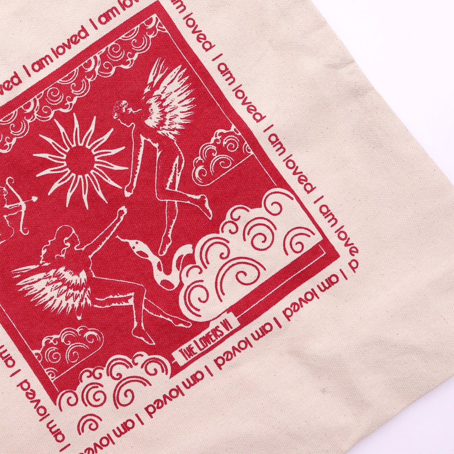 Lovers Tarot Card Cotton Canvas Tote Bag - I Am Loved with a close-up red illustration of two figures, a sun and a bird by Quintessential Holistic Health Ltd