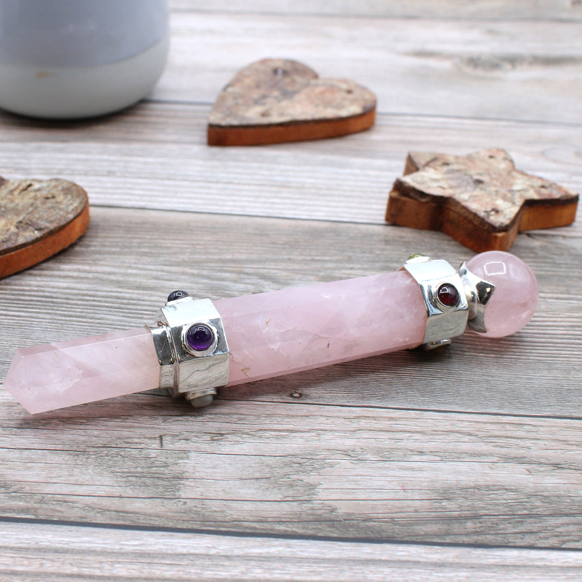Handmade Hexagonal Healing Wand - Rose Quartz Gemstone with pale pink pointed shaft and decorative silver-tone bands by Quintessential Holistic Health Ltd