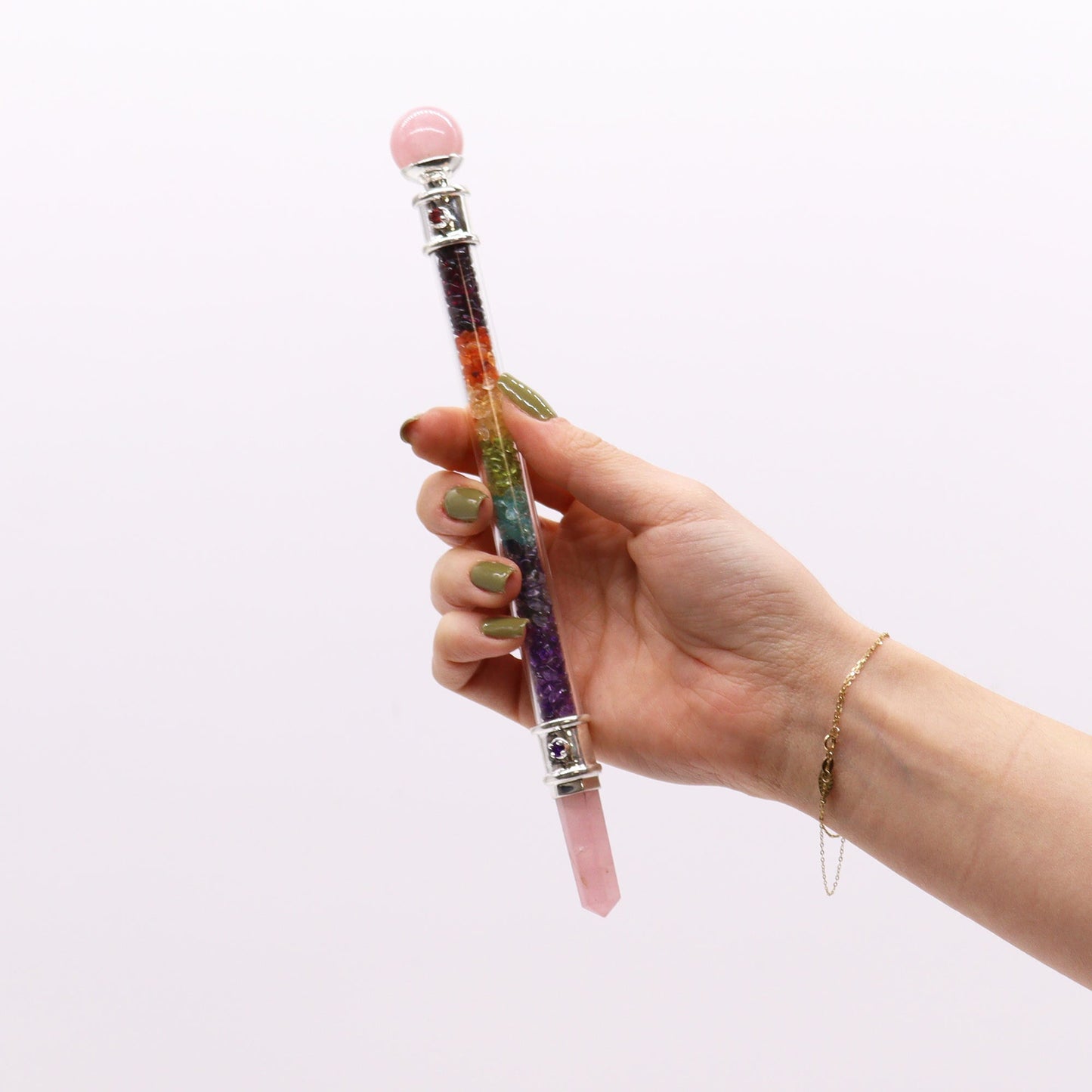 Handmade 7 Chakra Crystal Healing Wand - Rose Quartz Gemstone held upright in one hand with pink ends and a multicoloured centre, by Quintessential Holistic Health Ltd
