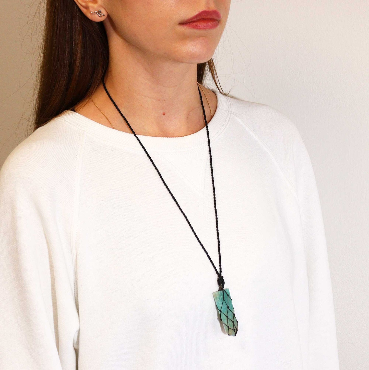 Handmade Laced Gemstone Pendant - Flat Point / Amazonite product packaging on clean background from Quintessential Holistic Health Ltd