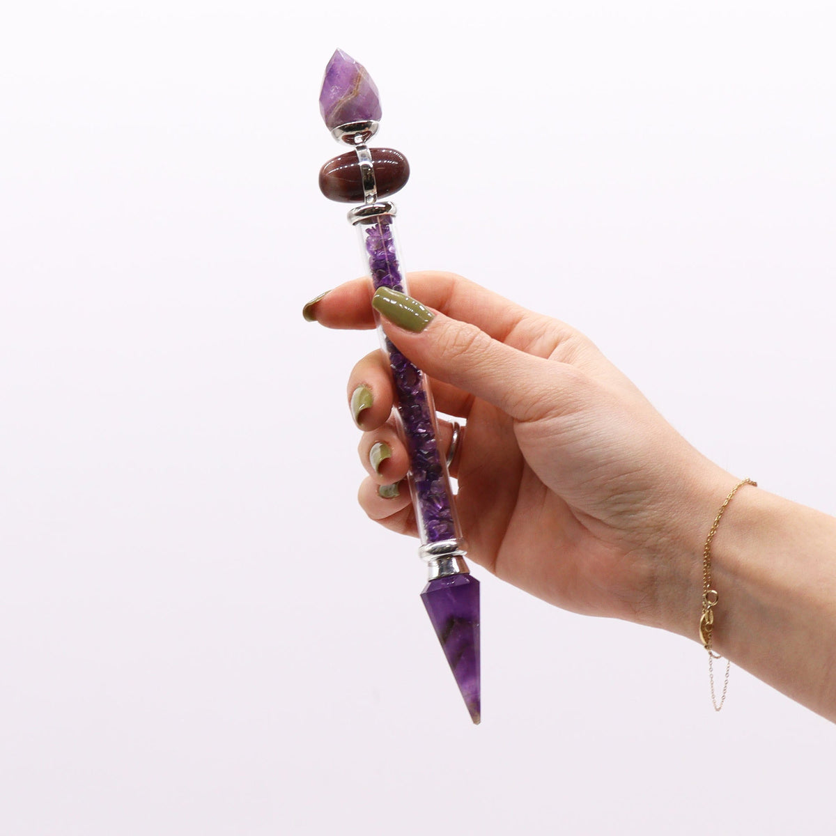 Shiva Lingam Wand - Amethyst Gemstones - Success, 19.5 × 3 cm, purple crystal wand held upright in one hand, by Quintessential Holistic Health Ltd