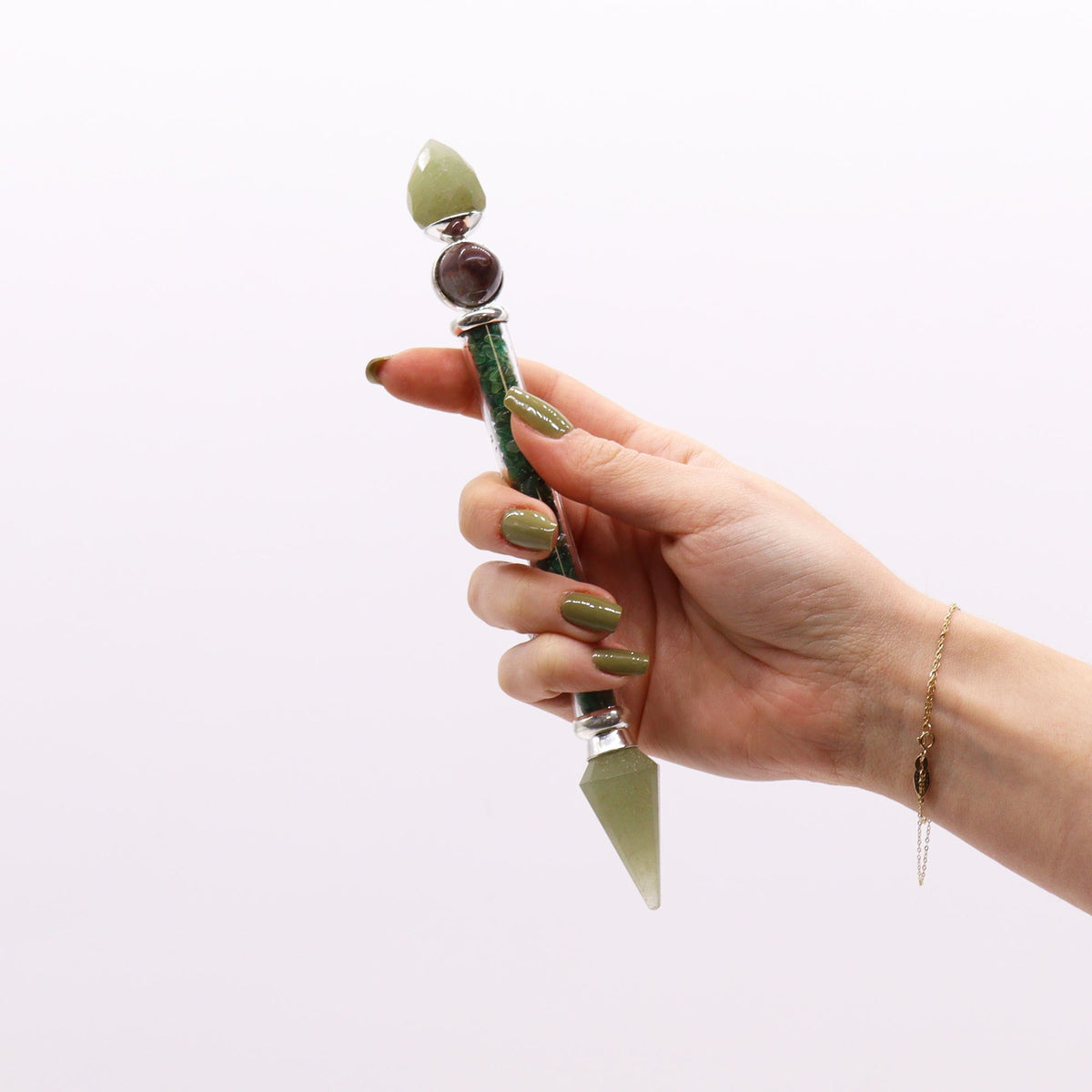 Shiva Lingam Magic Wand - Green Aventurine - Happiness, green crystal wand with pale green points held upright in one hand, by Quintessential Holistic Health Ltd