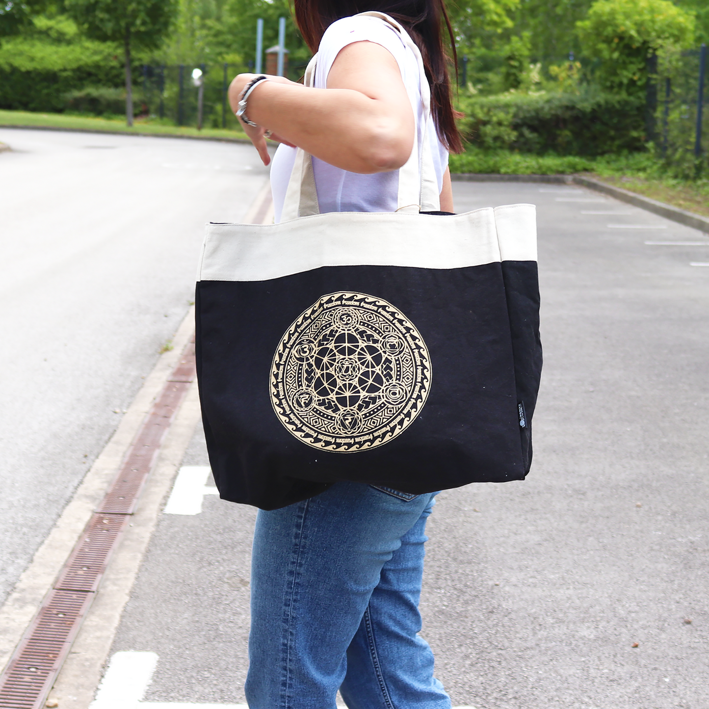 Handmade Oversized Natural Cotton Tote Bag - Freedom Chakra Mandala, two-tone bag with gold circular design carried at the side, by Quintessential Holistic Health Ltd