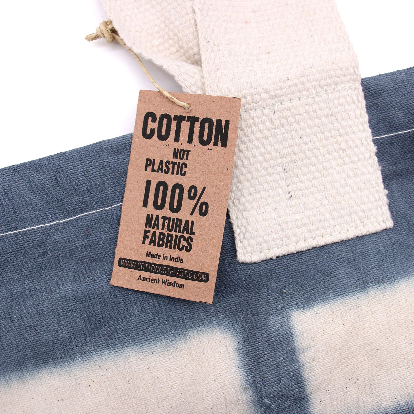 100% Natural Cotton Tie-Dyed Bag - Blue Flower, Blue Handle close-up with blue and natural panels and a brown cotton tag by Quintessential Holistic Health Ltd
