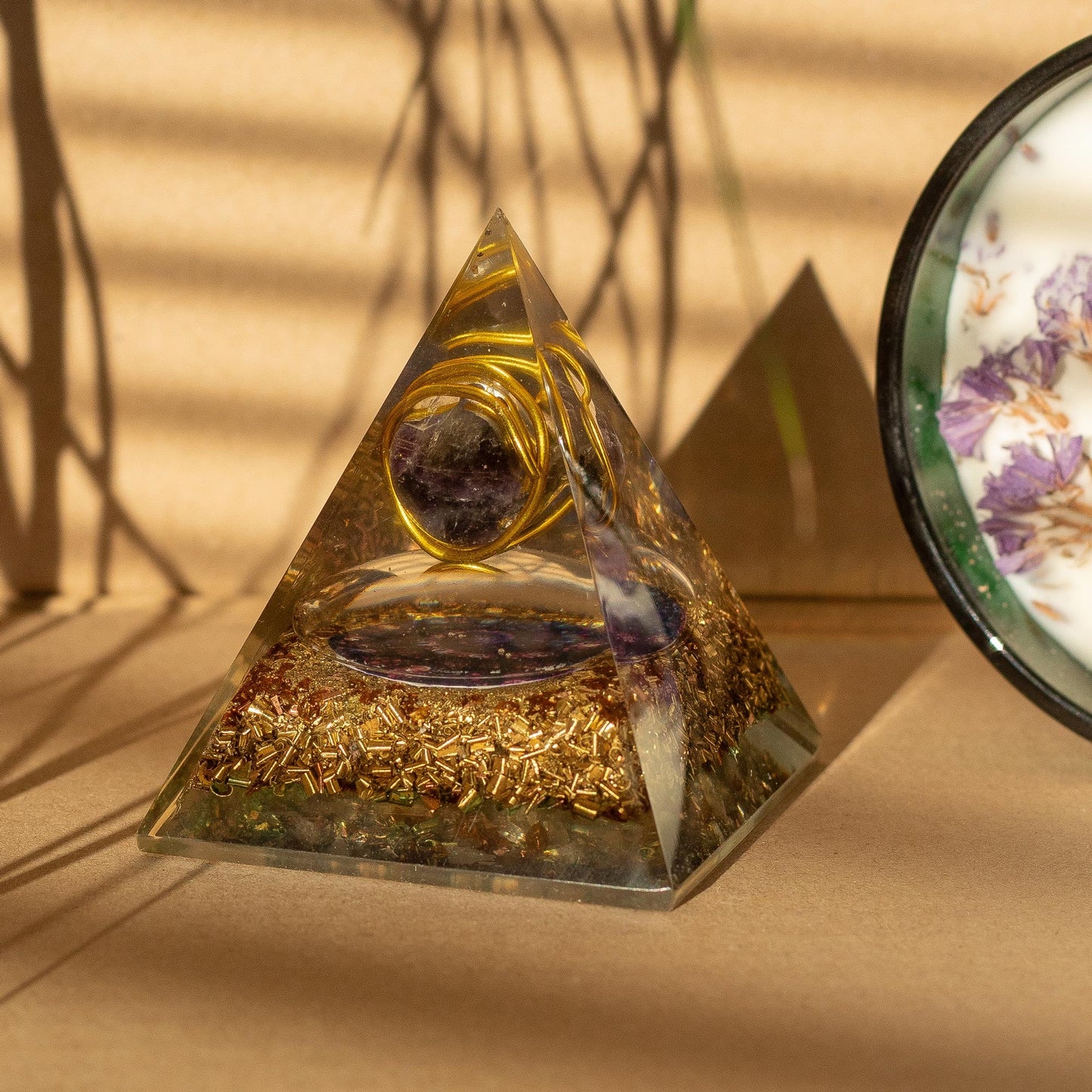 Orgonite Paperweight - Medium Amethyst Copper Pyramid, with a purple sphere, gold-tone spiral and broad square base by Quintessential Holistic Health Ltd