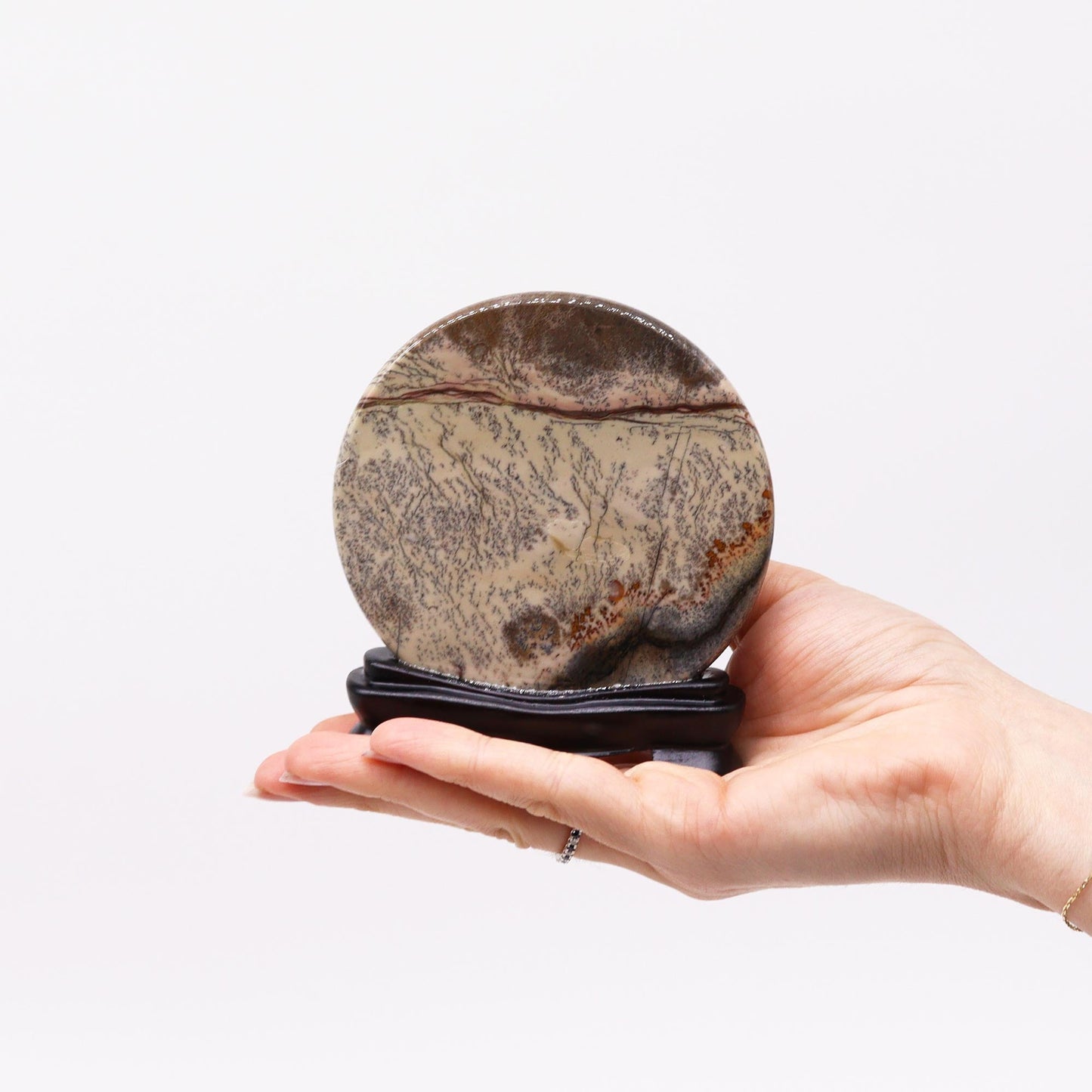 Ancient Natural Stone Guohua Picture - Disc with sweeping brown lines, held on an open hand by Quintessential Holistic Health Ltd