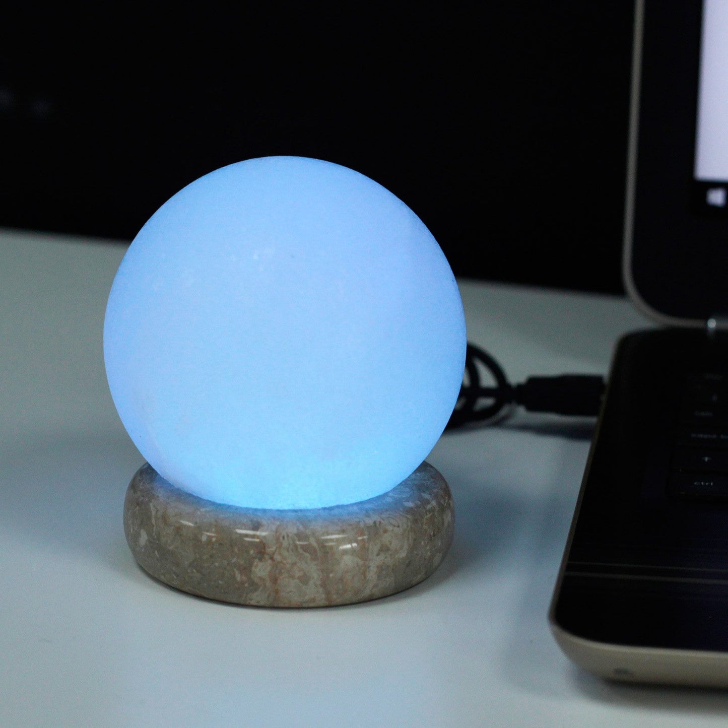 Hand Carved USB Himalayan Salt Crystal Lamp with Base - White and Natural / Round / Multicoloured Light product packaging on clean background from Quintessential Holistic Health Ltd