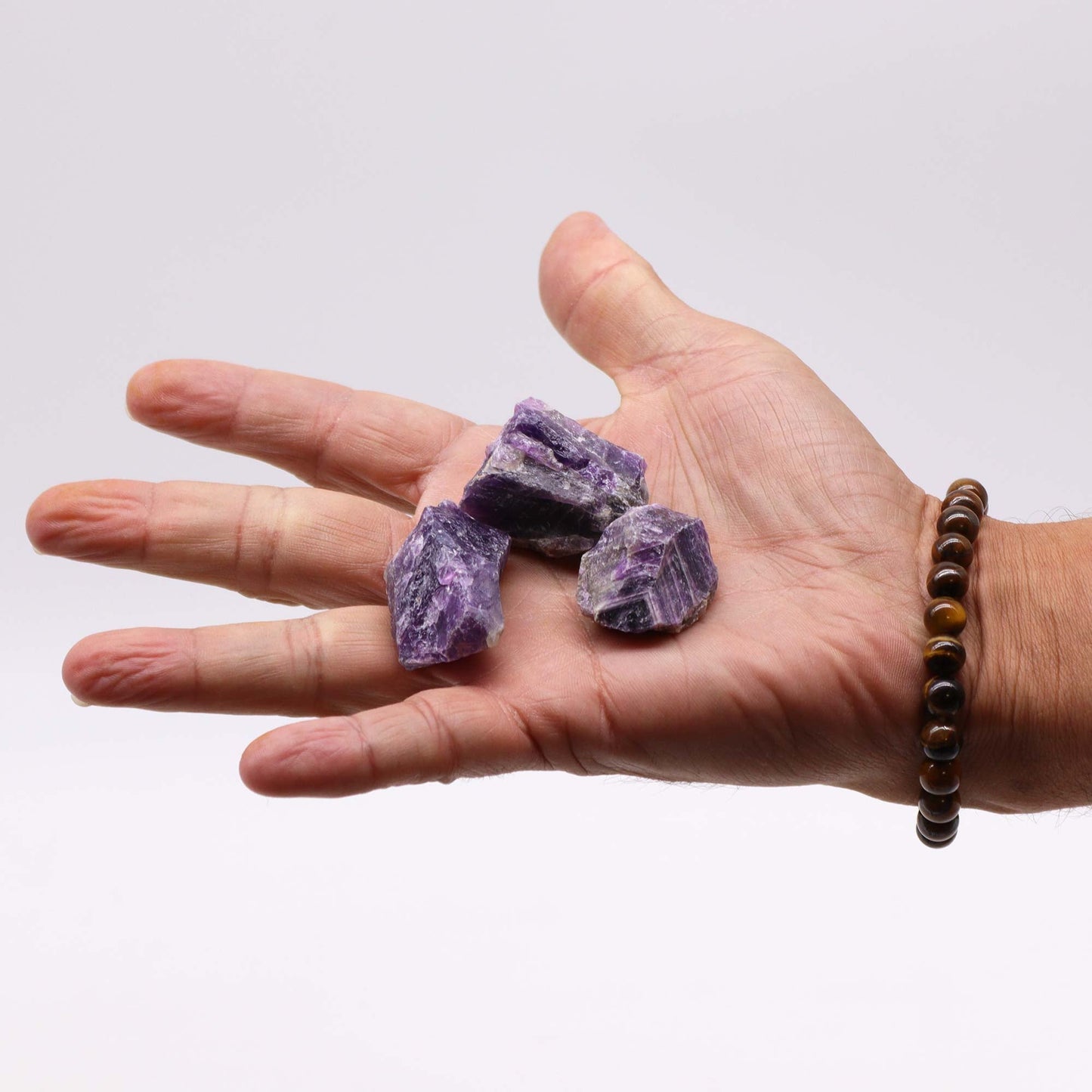 500g Raw Crystals - Amethyst product packaging on clean background from Quintessential Holistic Health Ltd