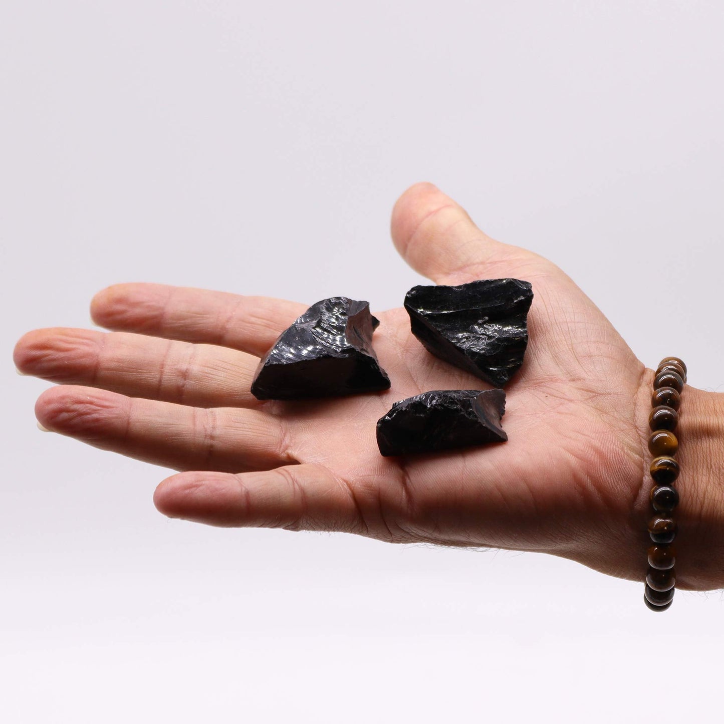500g Raw Crystals - Black Agate product packaging on clean background from Quintessential Holistic Health Ltd