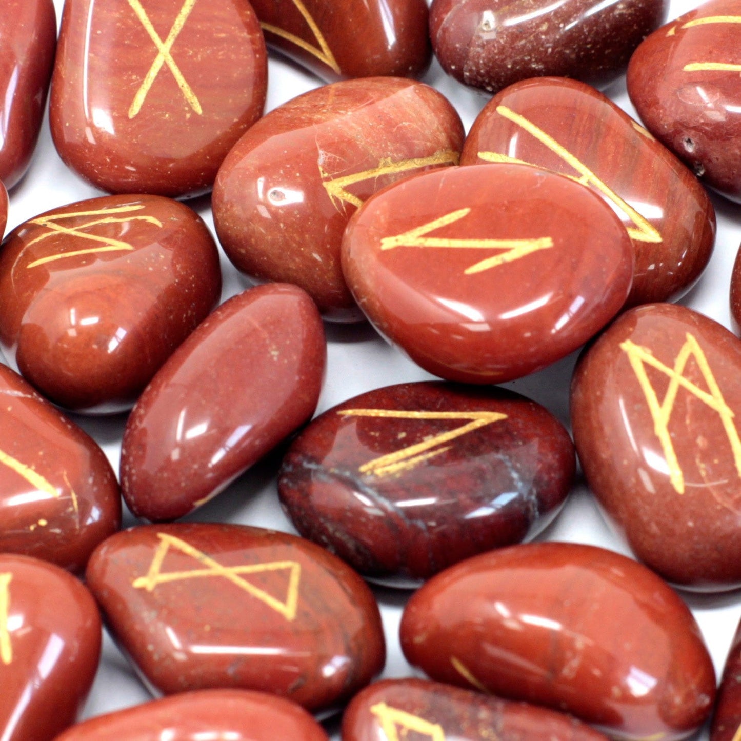 Rune Stone Set in a Pouch - Red Jasper Gemstones product packaging on clean background from Quintessential Holistic Health Ltd