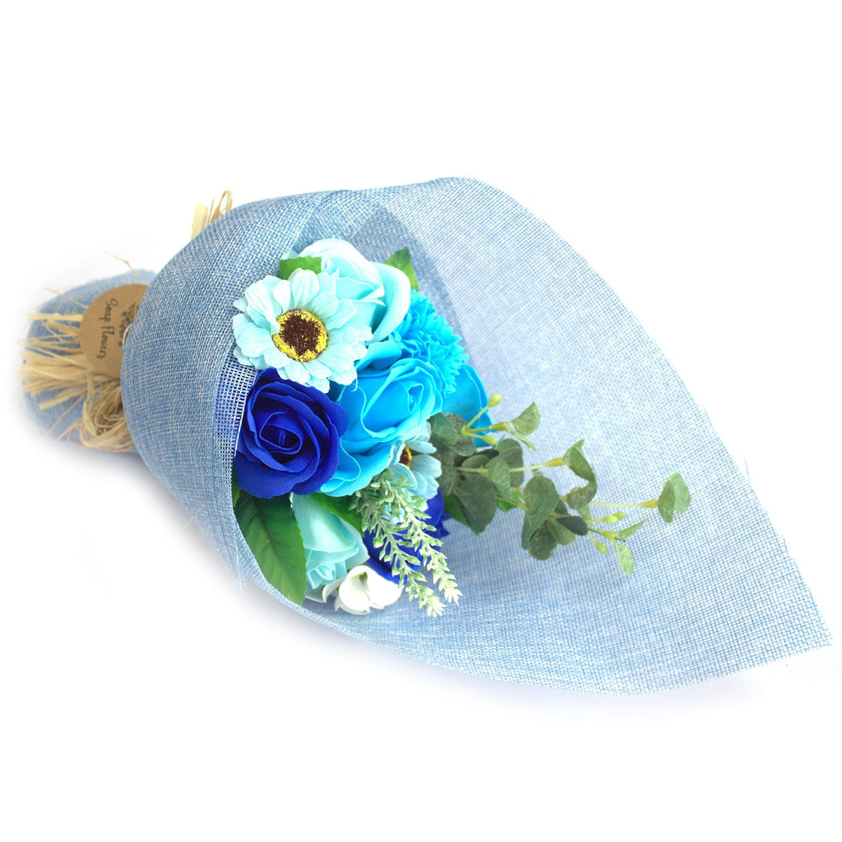 Standing Soap Flower Bouquet - Blue, laid on its side with blue and white flowers and rounded green foliage, by Quintessential Holistic Health Ltd