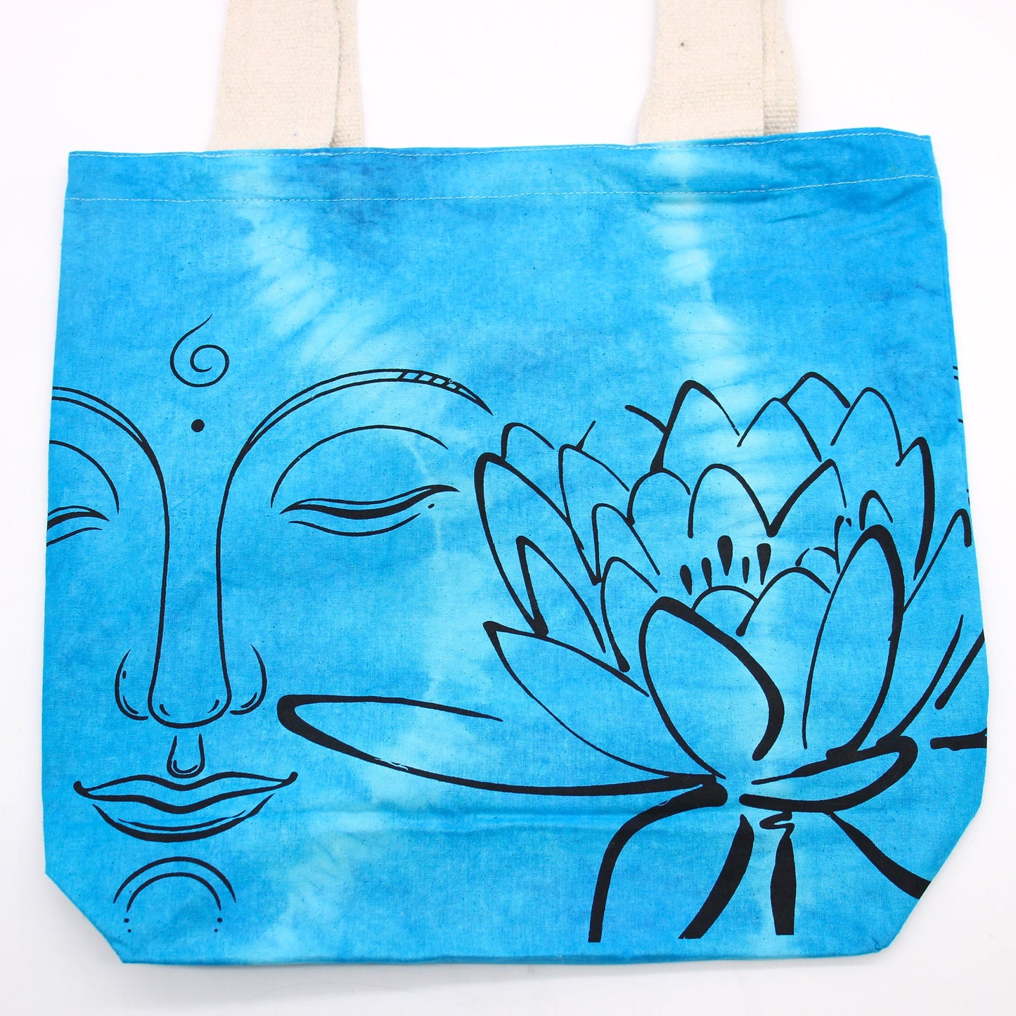 Tie-Dyed Cotton Tote Bag - Buddha and Lotus Flower - Blue with bold black facial and lotus linework across the front by Quintessential Holistic Health Ltd