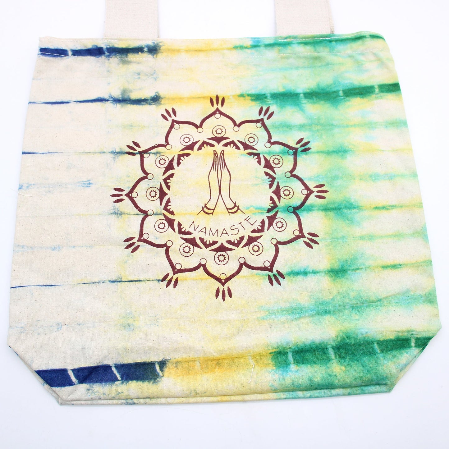 Tie-Dyed Cotton Tote Bag - Namaste Hands - Multicolour with blue, yellow and green bands around a central Namaste motif by Quintessential Holistic Health Ltd