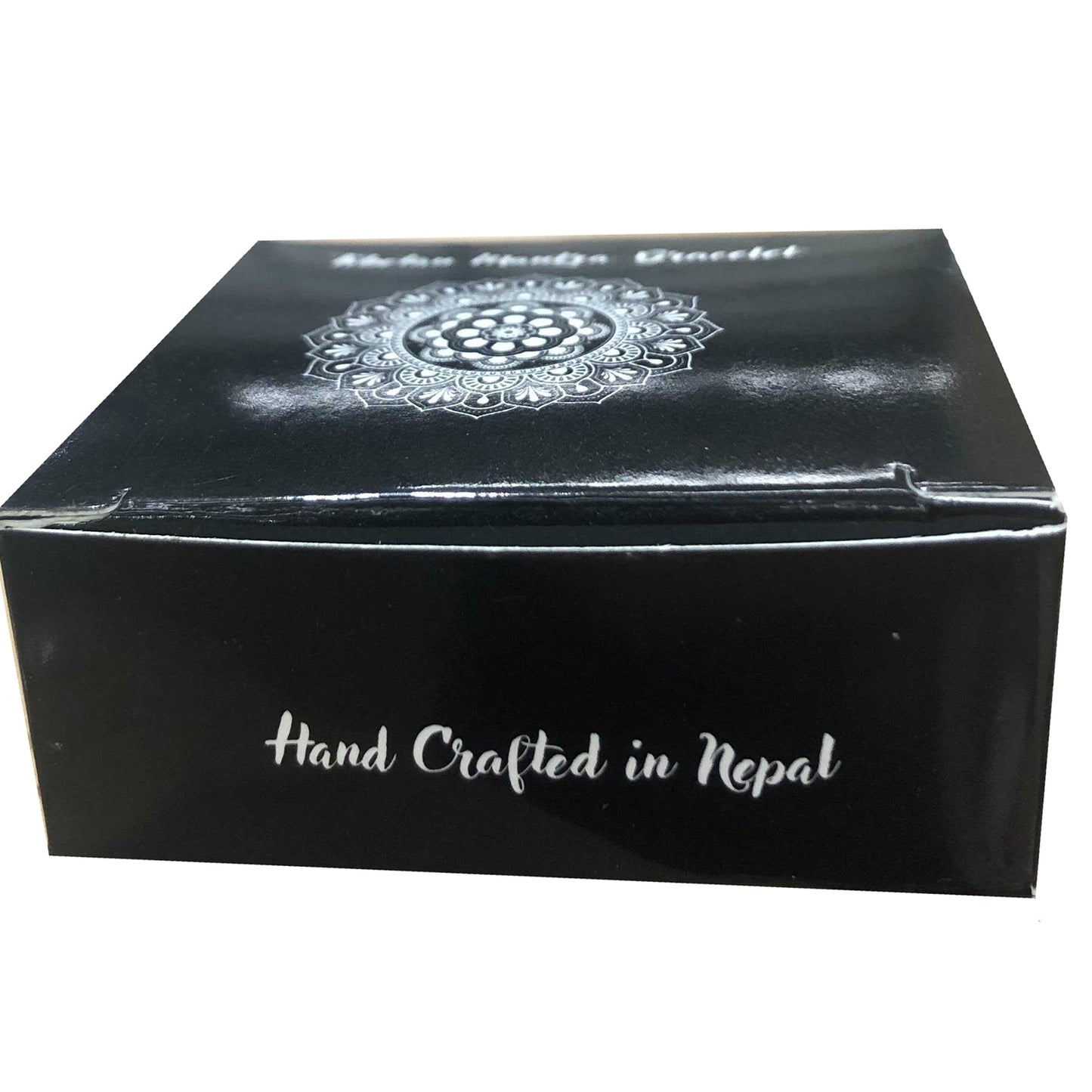 Handcrafted Copper Tibetan Bracelet - Slim Tribal Swirls product packaging on clean background from Quintessential Holistic Health Ltd