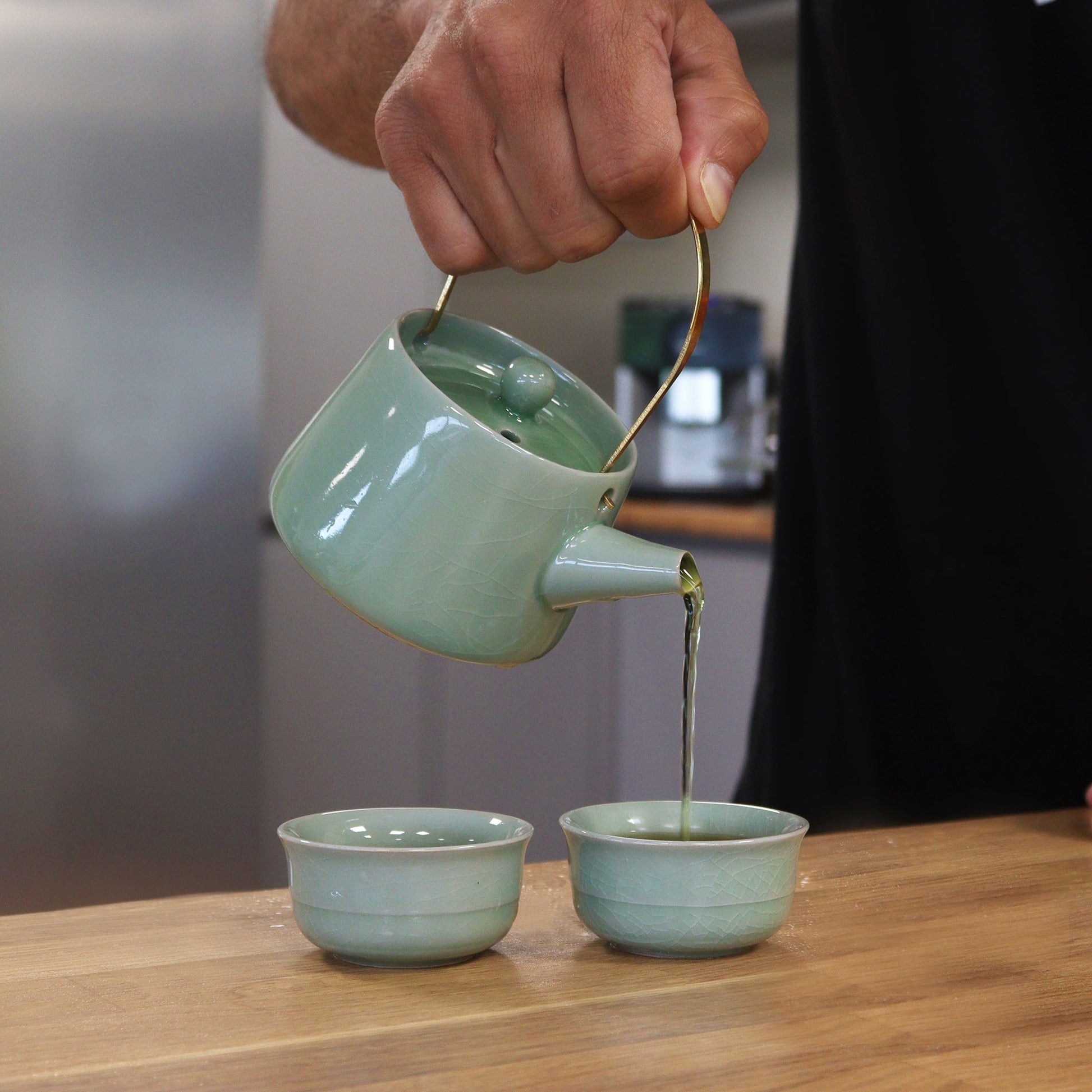200ml Jade Ceramic Herbal Teapot Pouring Tea into a Matching Cup