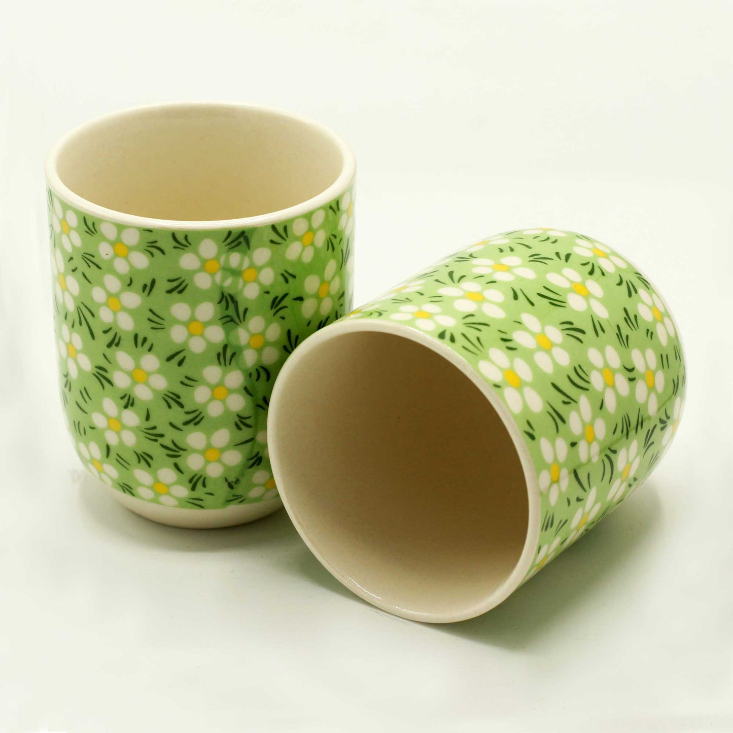  2 Ceramic Green Daisy Design Herbal Tea Cups with One Lying Down