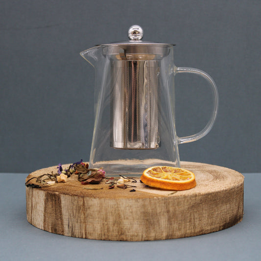 750ml Glass Tower Infuser Teapot with Stainless Steel Strainer Sitting on a Chopping Board