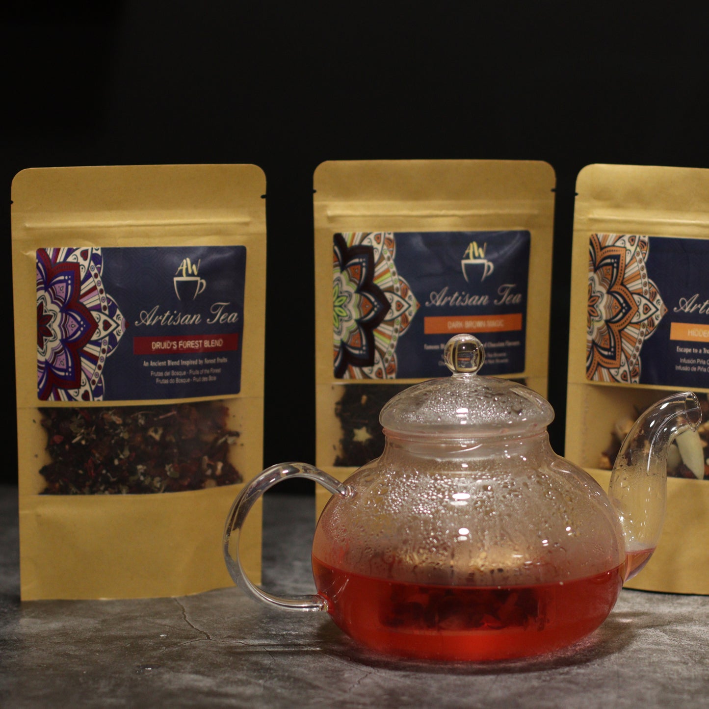 800ml Glass Round Pearl Infuser Teapot Sitting in front of Tea Sachets