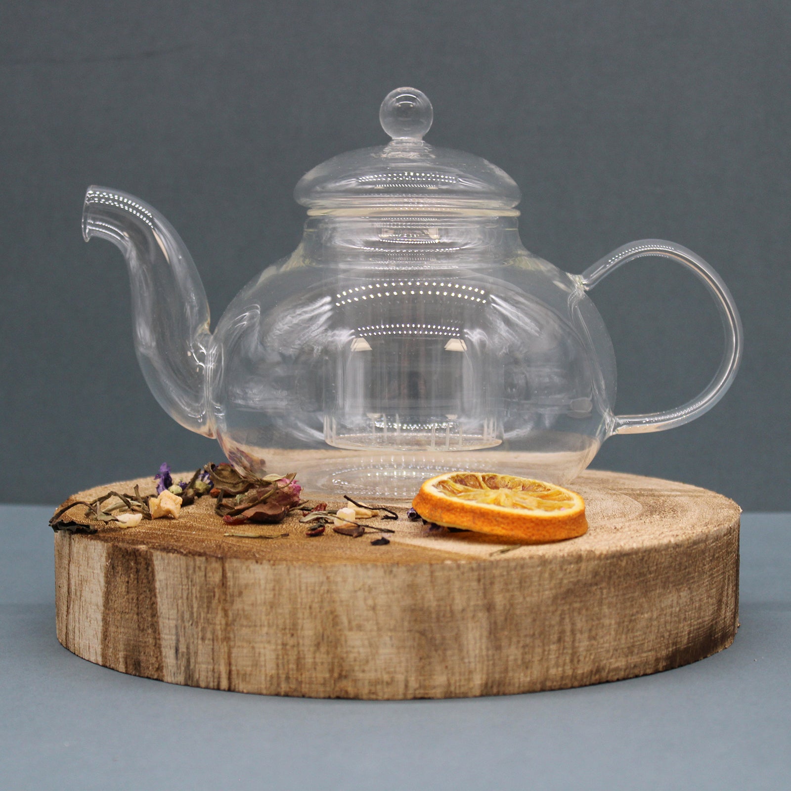 800ml Glass Round Pearl Infuser Teapot Sitting on a Chopping Board