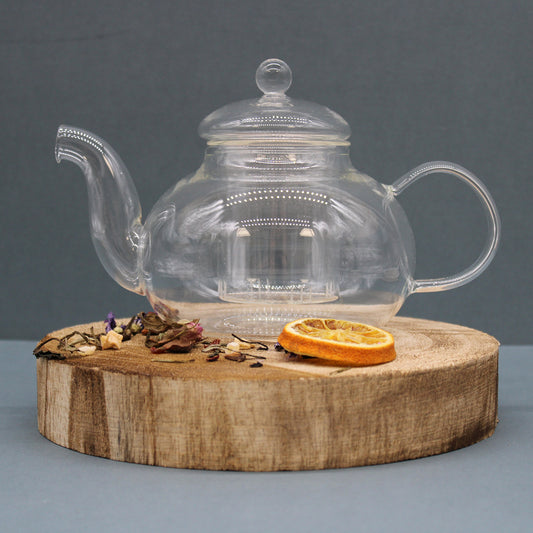 800ml Glass Round Pearl Infuser Teapot Sitting on a Chopping Board