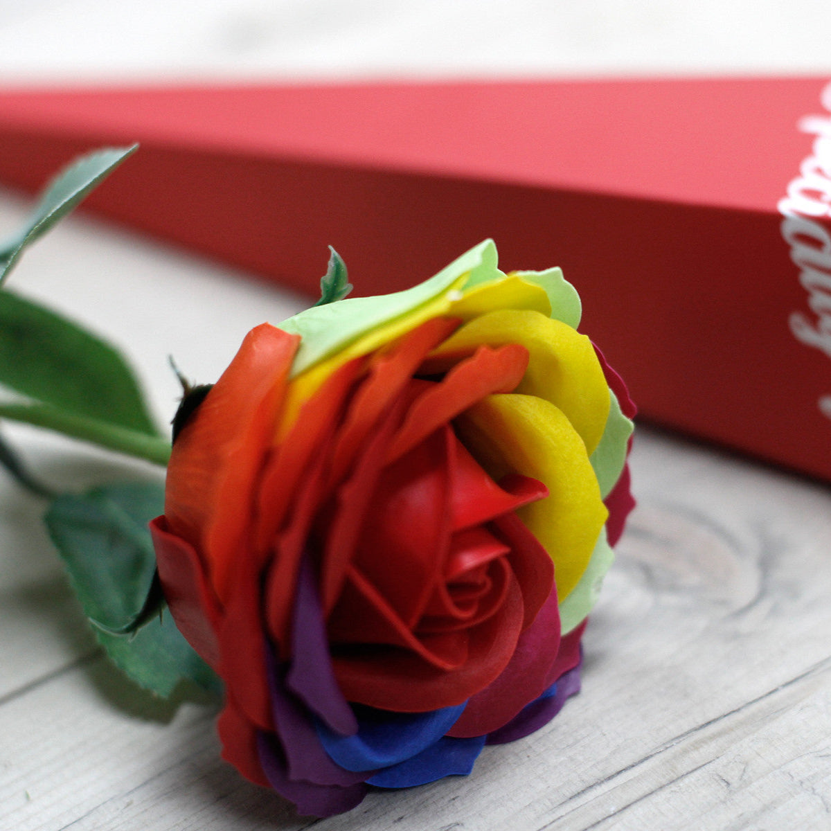 Luxury Rainbow Single Rose Flower Soap next to a Gift Box