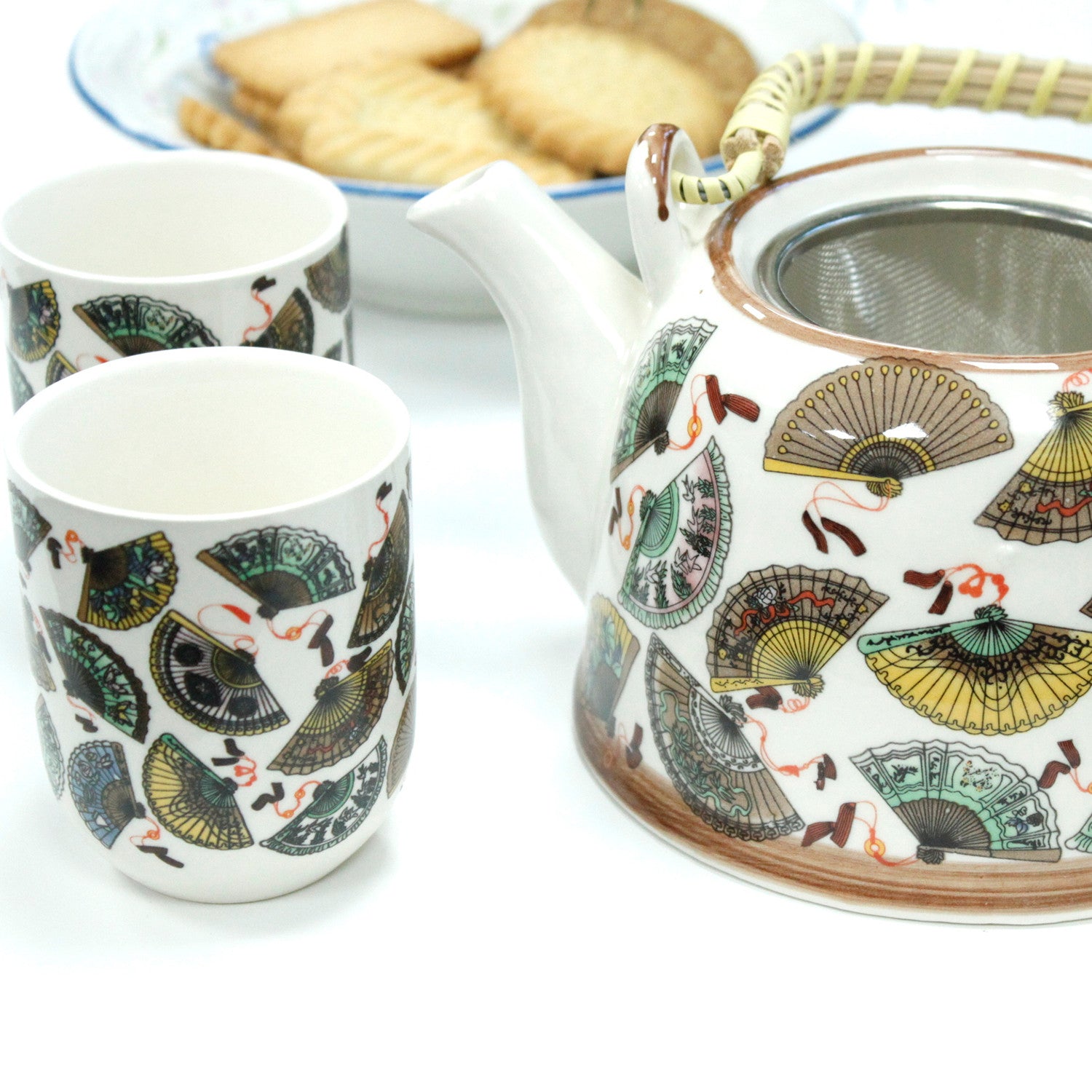 Side View of the 650ml Chinese Fan Design White Glazed Herbal Teapot with Strainer and a 6 Matching Cup Set