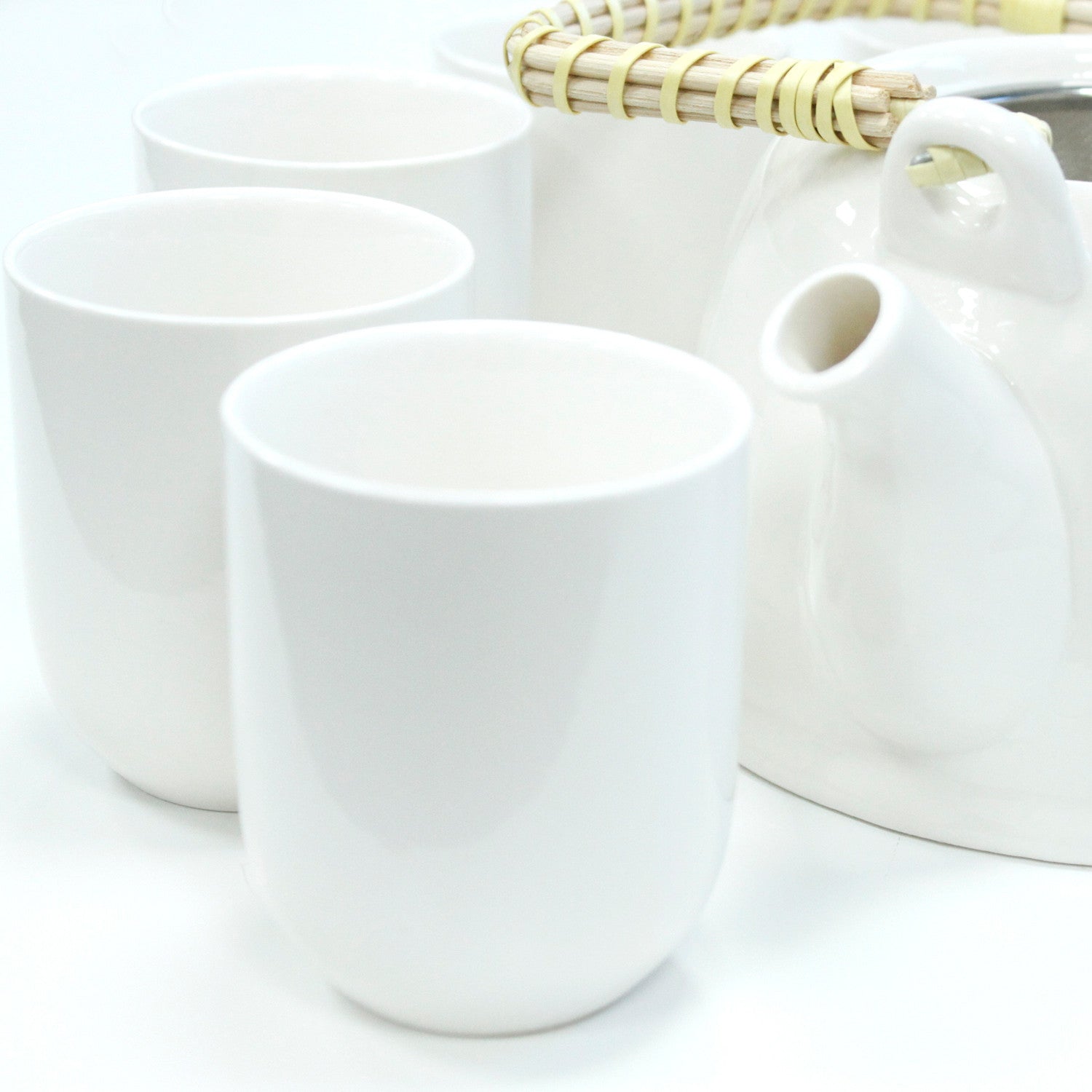 Zoomed in Side View of the 650ml Ceramic Classic Design White Glazed Herbal Teapot with Strainer and a 6 Matching Cup Set