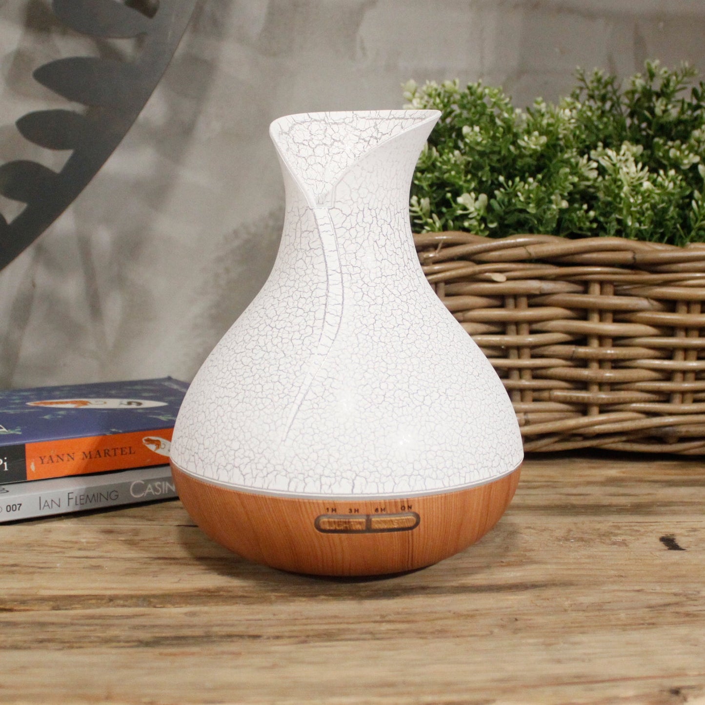 Colour-Changing USB Aroma Diffuser - Palma Shell, white crackle-patterned design with wood-effect base beside a woven basket, by Quintessential Holistic Health Ltd