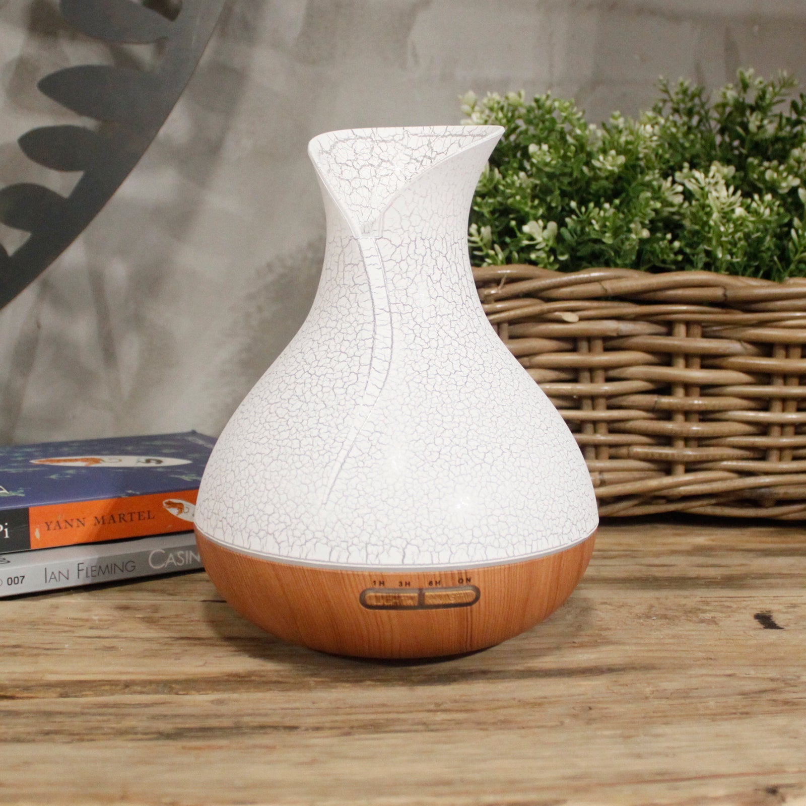 Colour-Changing USB Aroma Diffuser - Palma Shell, white crackle-patterned design with wood-effect base beside a woven basket, by Quintessential Holistic Health Ltd